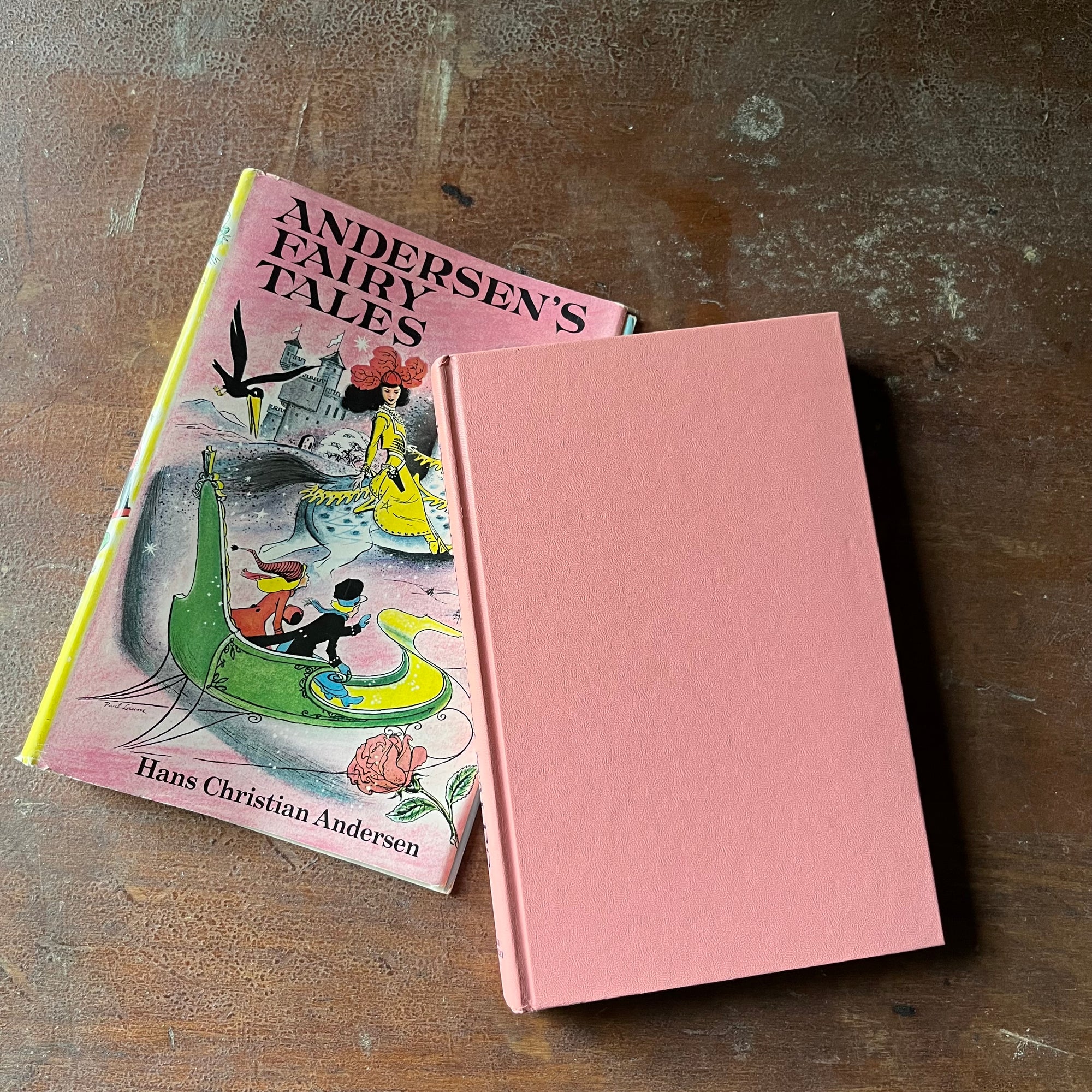 vintage children's chapter book, classic stories, must read children's book, Junior Deluxe Editions - Andersen's Fairy Tales written by Hans Christian Andersen with illustrations by Leonard Weisgard - view of the solid pink front cover