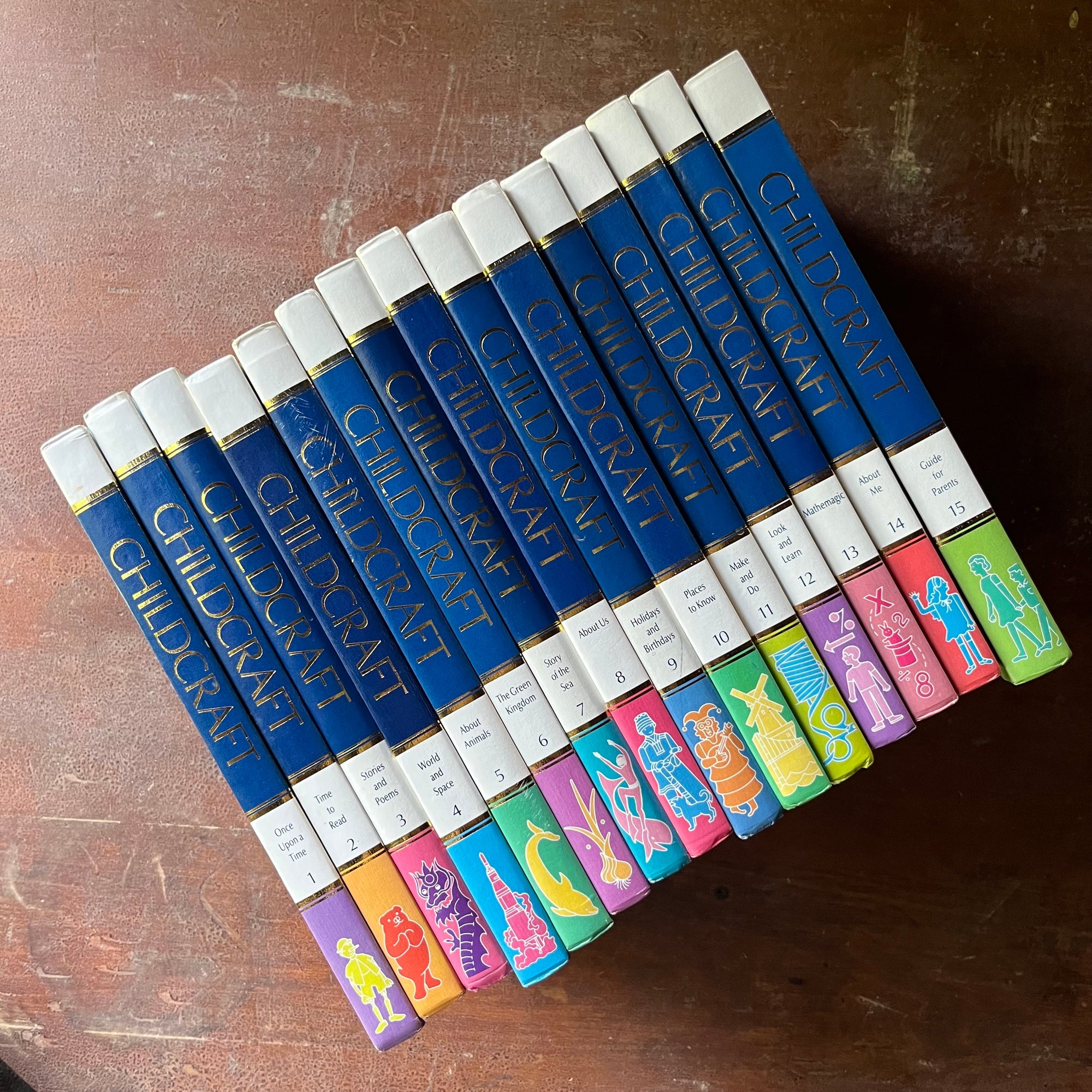 vintage children's book set, Childcraft How & Why Library 15 Volume Complete Set published by Wonder Books, Inc. - view of the spines