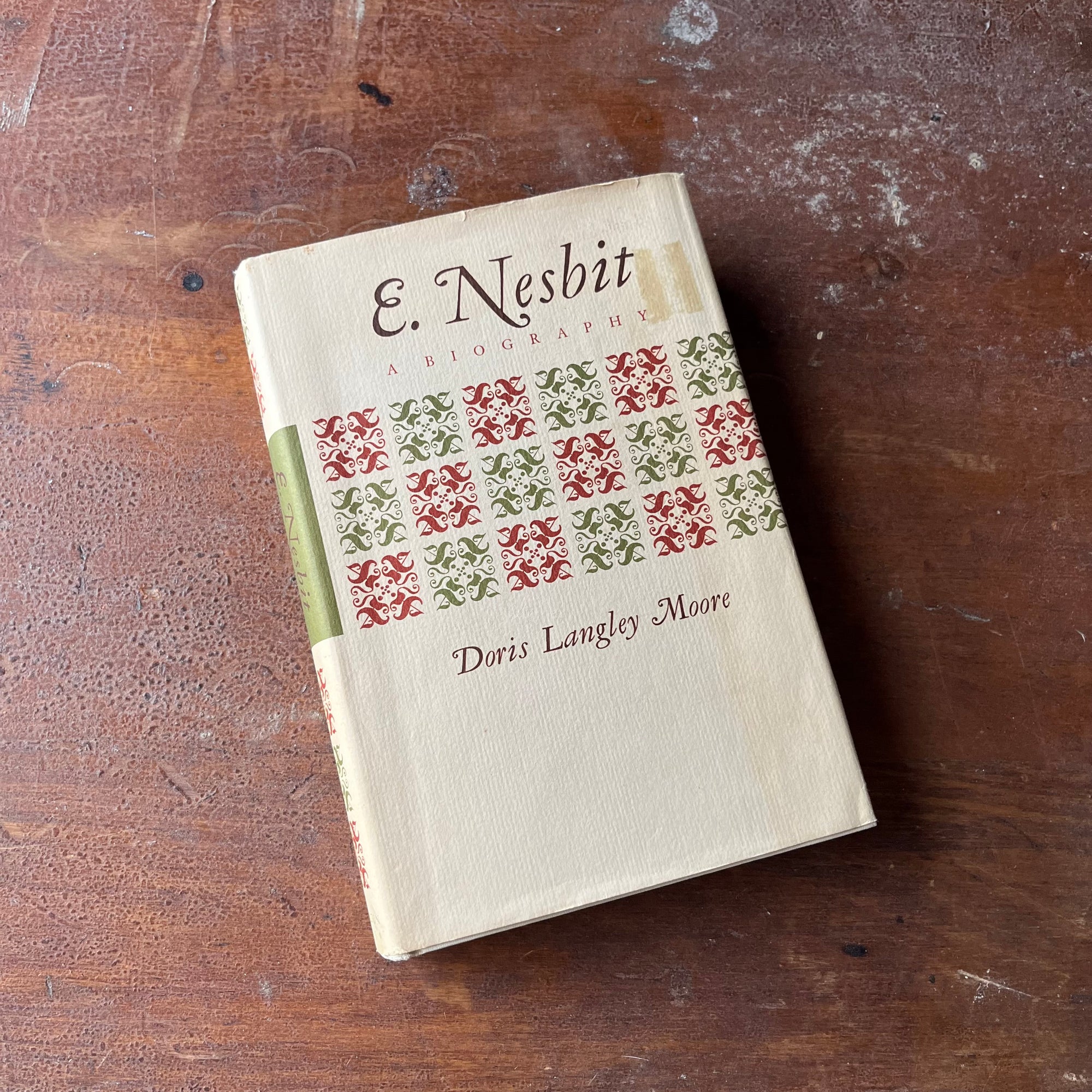 E. Nesbit A Biography by Doris Langley Moore-first edition-vintage children's author biography - view of the colorful dust jacket's front cover - red & green design across the middle along with the title of the book & author listed