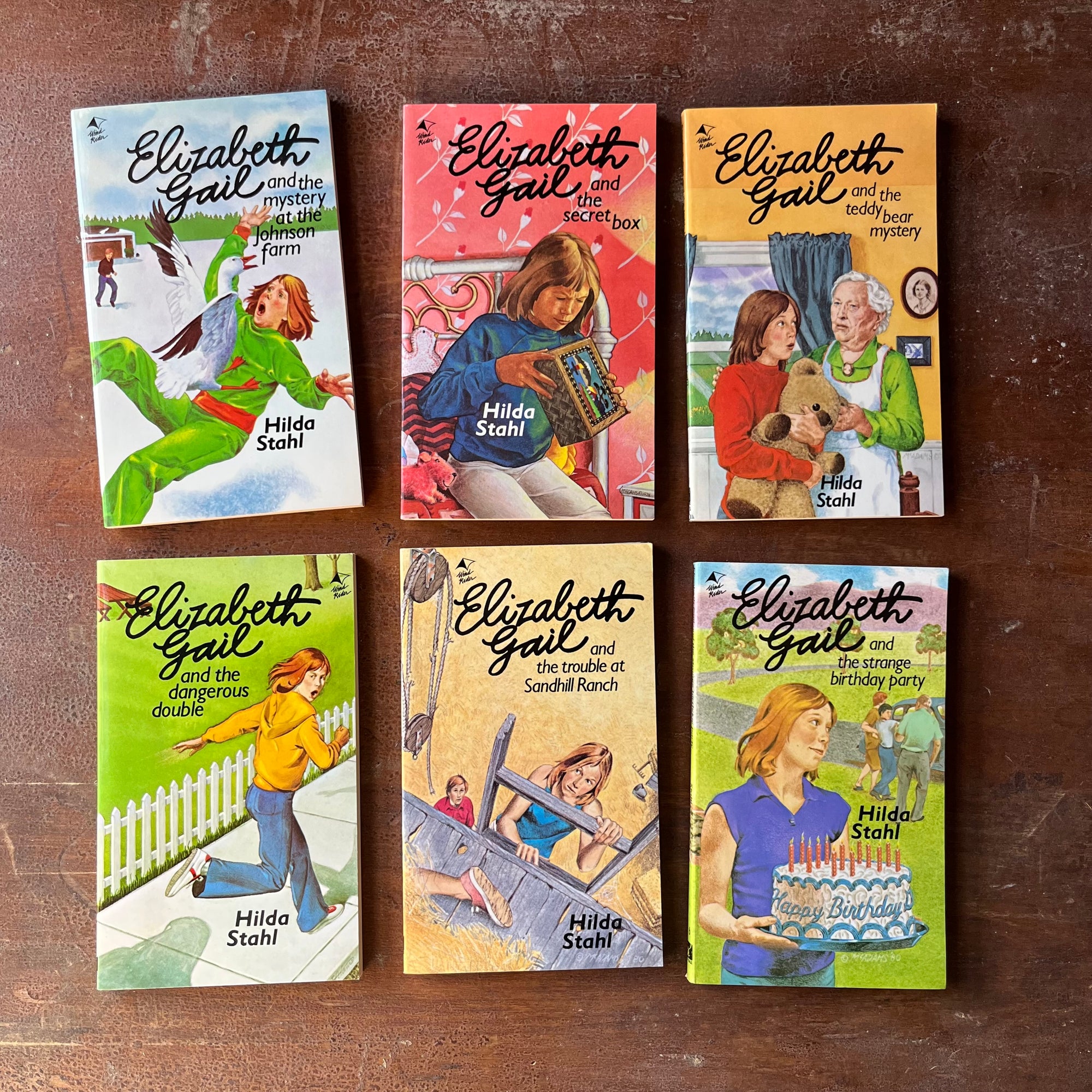Elizabeth Gail Book Set written by Hilda Stahl-First 6 Volumes-vintage children's chapter books-view of the front covers with illustrations of Elizabeth from scenes from each book - each cover uses bright colors