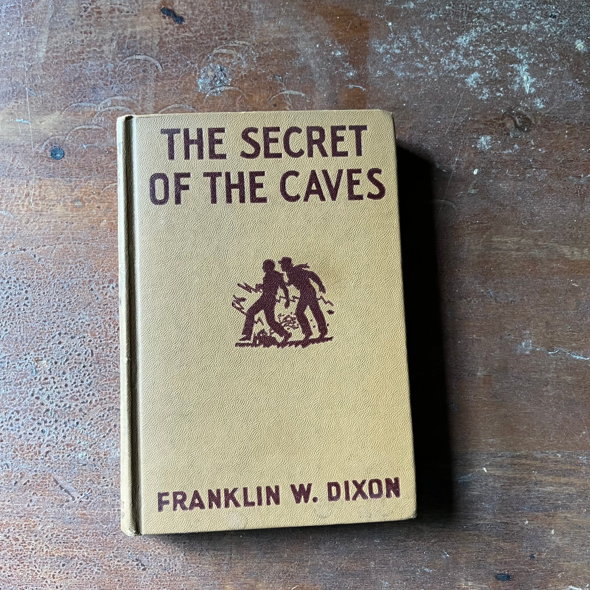vintage children's chapter book, vintage adventure book for boys, homeschool library, The Hardy Boys Mystery Book - #7  The Hardy Boys and the Secret of the Caves written by Franklin W. Dixon - view of the front cover
