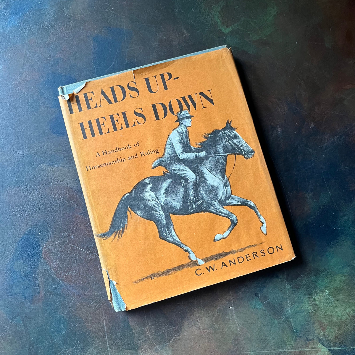 Heads Up-Heels Down-A Handbook of Horsemanship and Riding written and illustrated by C. W. Anderson-first edition-view of the dust jacket's front cover