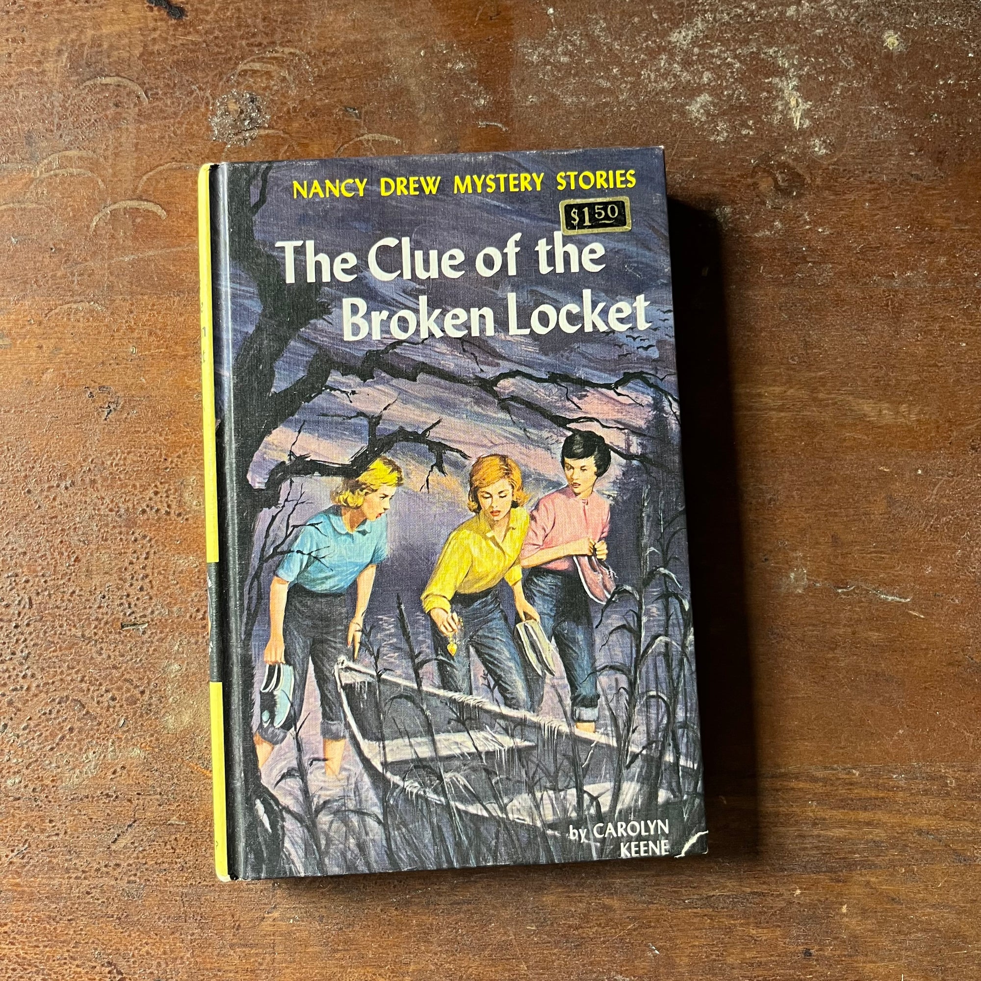 vintage children's chapter book, adventure books for girls, Nancy Drew Mystery Stories - #11 The Clue of the Broken Locket written by Carolyn Keene - view of the front cover with the original price sticker still attached