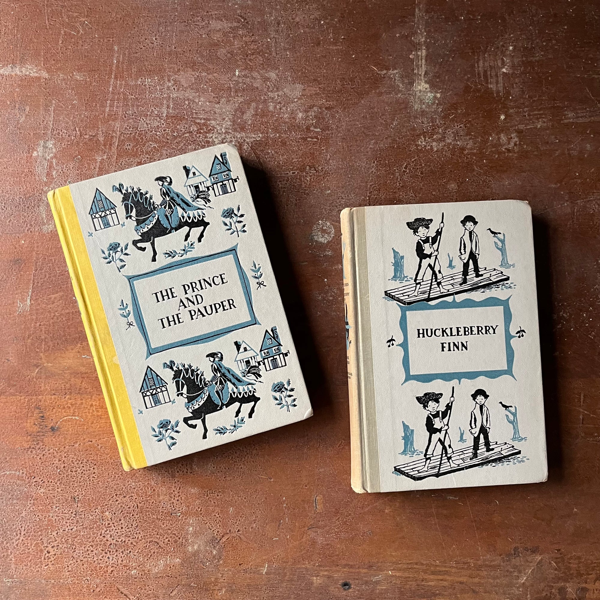 vintage children's books, classic American Literature - Pair of Junior Deluxe Editions Books Written by Mark Twain - The Adventures of Huckleberry Finn & The Prince and the Pauper - view of the decorative front covers