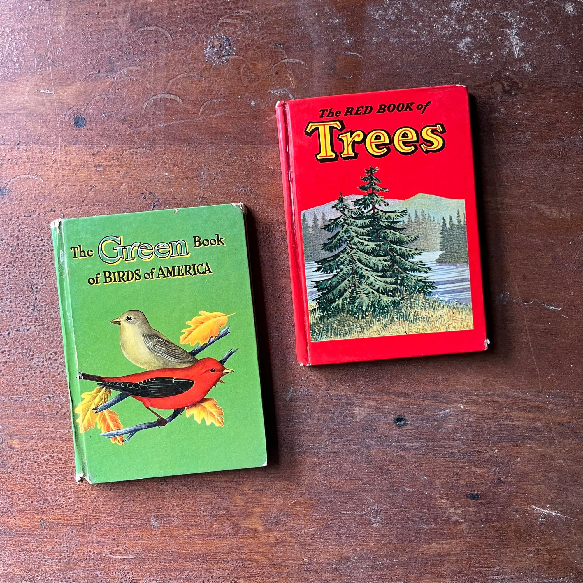 vintage pocket nature guides published by The Whitman Publishing Company - Pair of Whitman Nature Guides:  The Green Book of Birds of America and The Red Book of Trees - view of the front covers