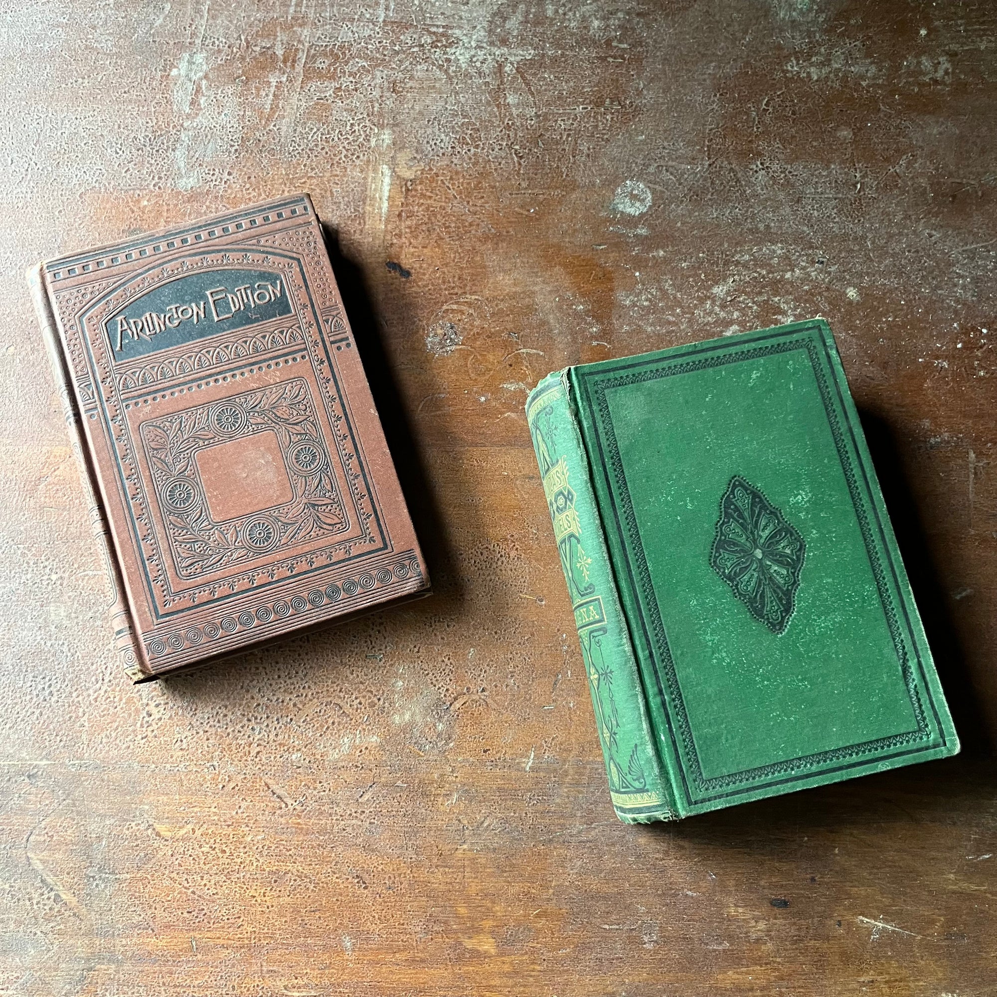 antique books, antique fiction books - Pair of books written by Ouida-A House Party (an Arlington Edition) & Signa - view of the embossed front covers