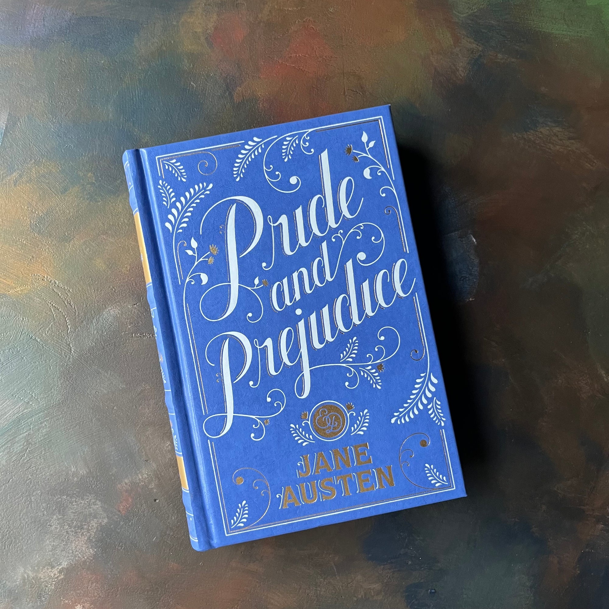 Pride and Prejudice written by Jane Austen-2011 Barnes & Noble Edition-classic literature in a modern edition-view of the front cover in blue, white and gold design