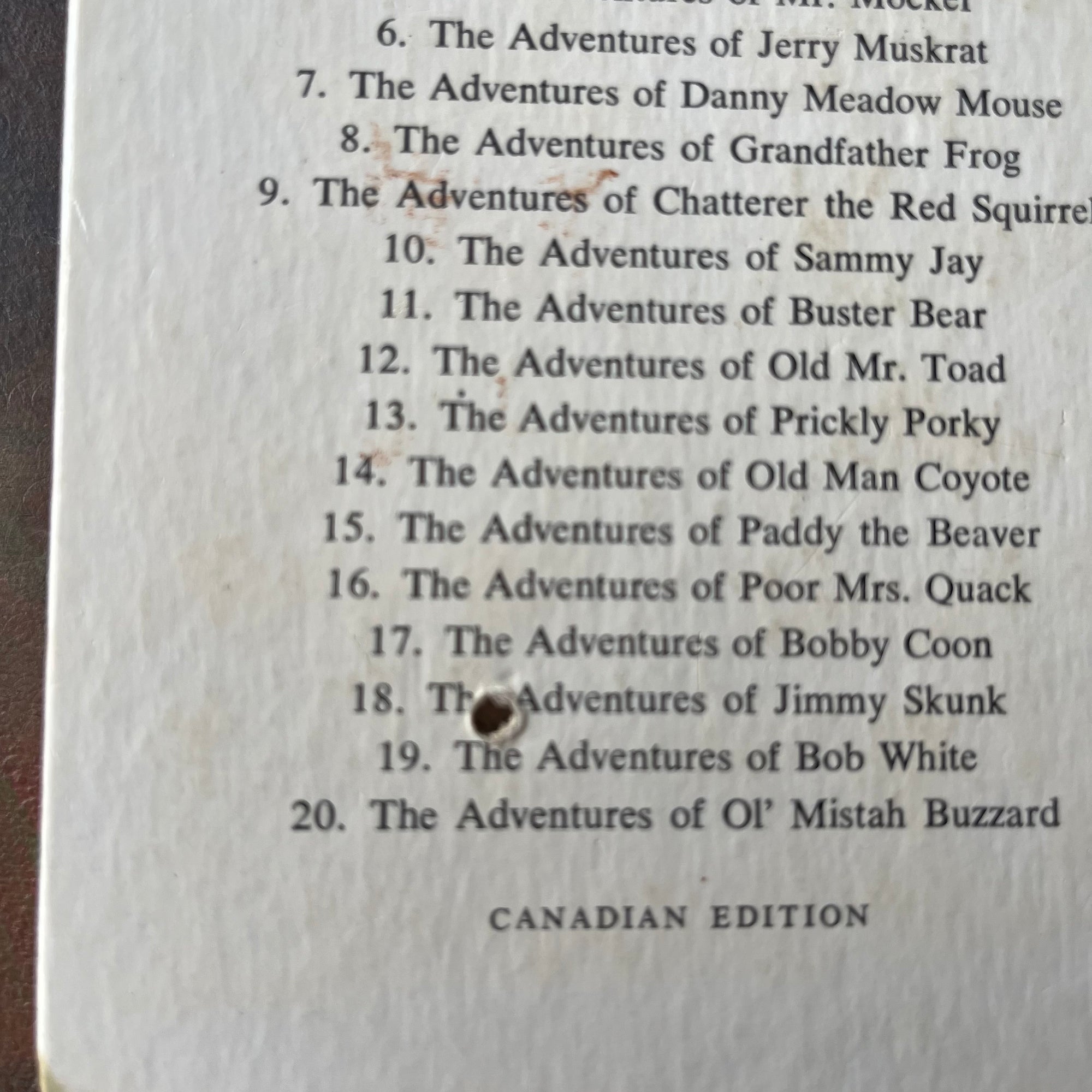 Set of Four of The Bedtime Story-Books written by Thornton W. Burgess with illustrations by Harrison Cady- The Set includes The Adventures of: Prickly Porky, Chatterer the Red Squirrel, Johnny Chuck, and Reddy Fox-vintage read alouds-view of the hole in the back pages of Reddy Fox.
