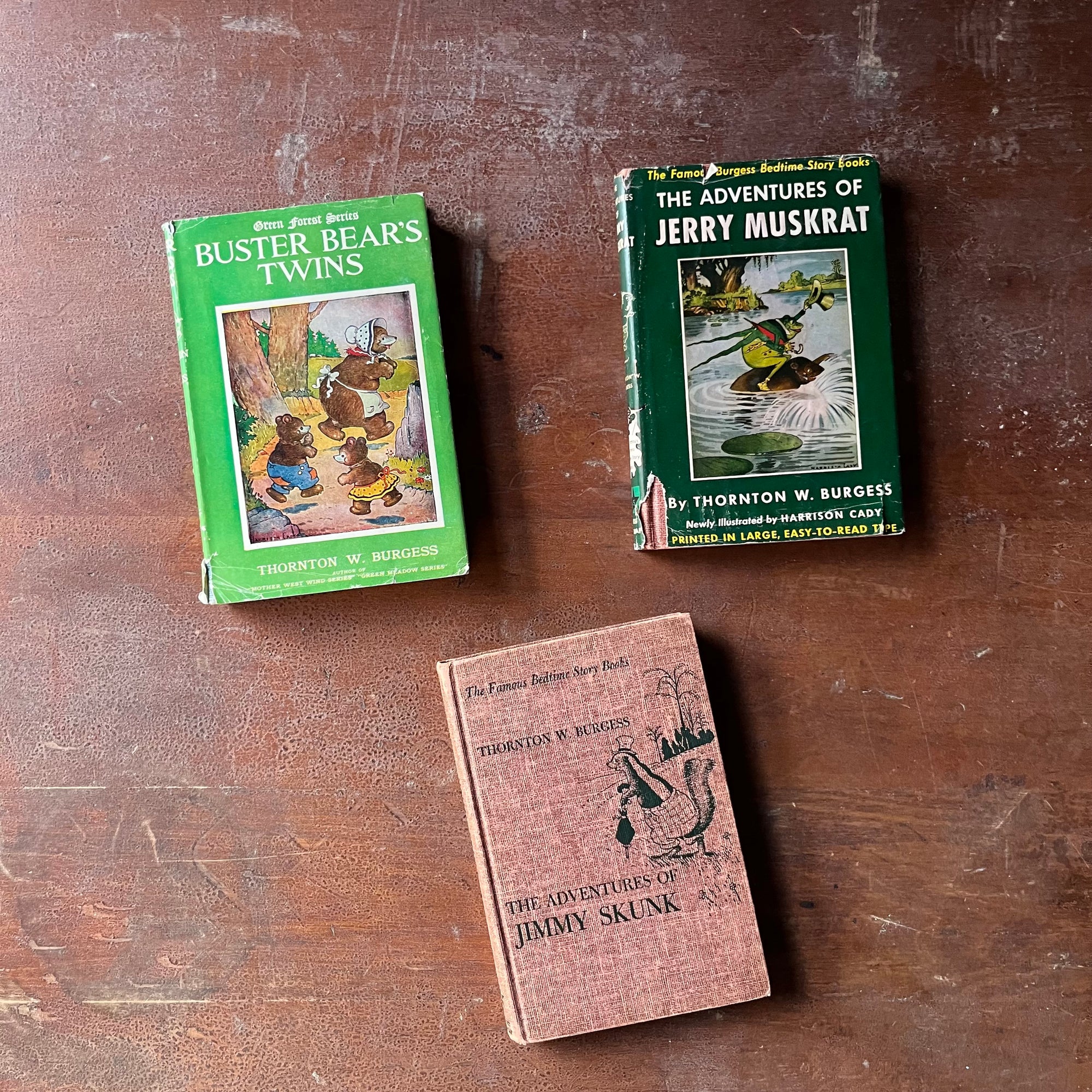 vintage children's chapter books, antiquarian books for children - Set of Three Thorton W. Burgess Books:  Buster Bears Twins, The Adventures of Jerry Muskrat, and The Adventures of Jimmy Skunk all illustrated by Harrison Cady - view of the dust jacket's front covers