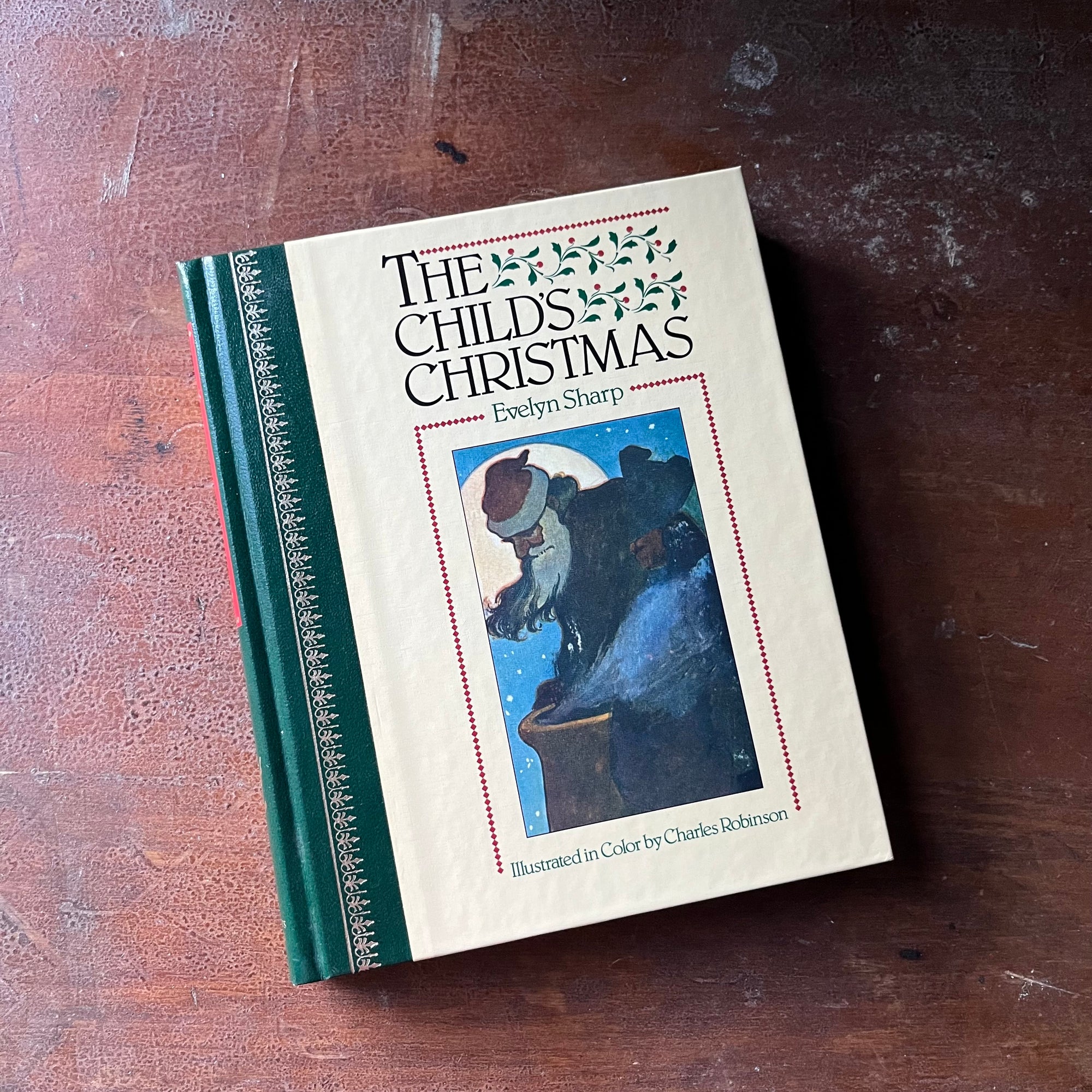 vintage children's Christmas book - The Children's Christmas written by Evelyn Sharp with illustrations by Charles Robinson - A Children's Classics Book - view of the glossy front cover with an illustration of Santa going down a chimney