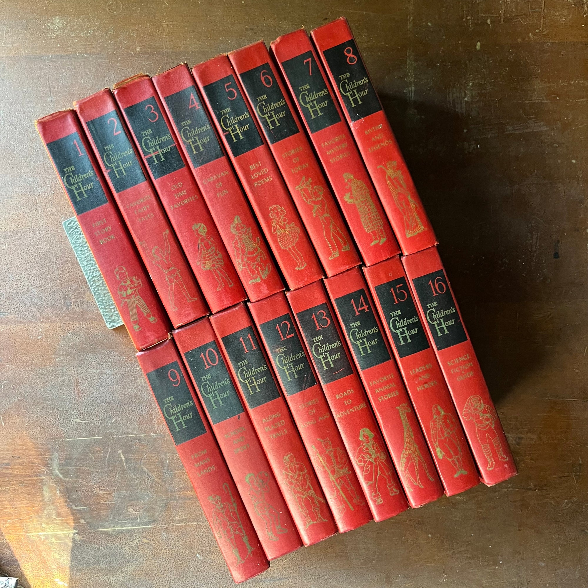 vintage children's storybook set - The Children's Hour Complete 16 Volume Book Set - view of the spines with an image on each under the name of the series & name of the volume