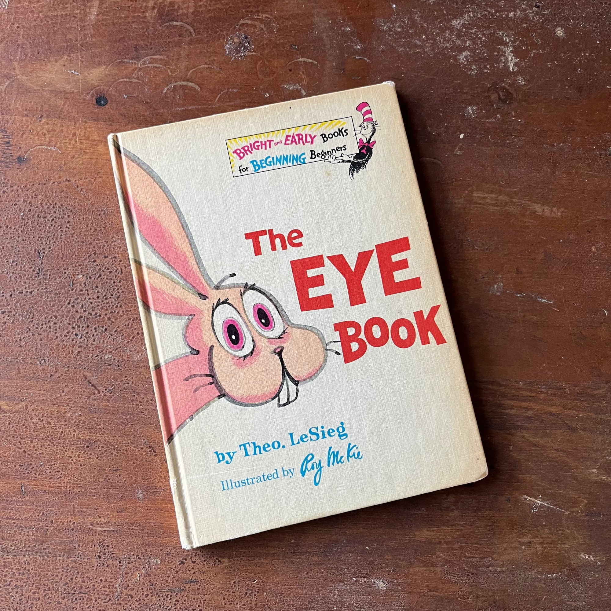 The Eye Book by Theo LeSieg-Bright & Early Books for Beginning Beginners-1968 Edition-vintage children's picture book-Dr. Seuss Book-view of the front cover with a pink rabbit with big teeth & eyes