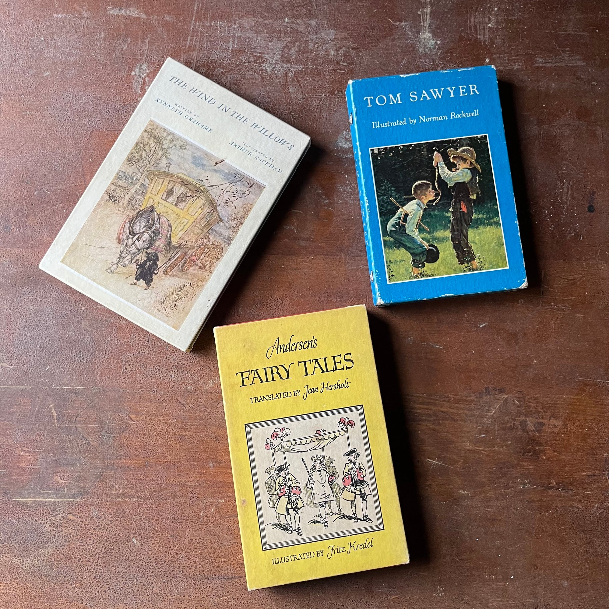 The Heritage Illustrated Bookshelf-Set of Three Books-Andersen's Fairy Tales, The Wind in the Willows & Tom Sawyer-view of the front of the book sleeves with illustrations & book titles listed