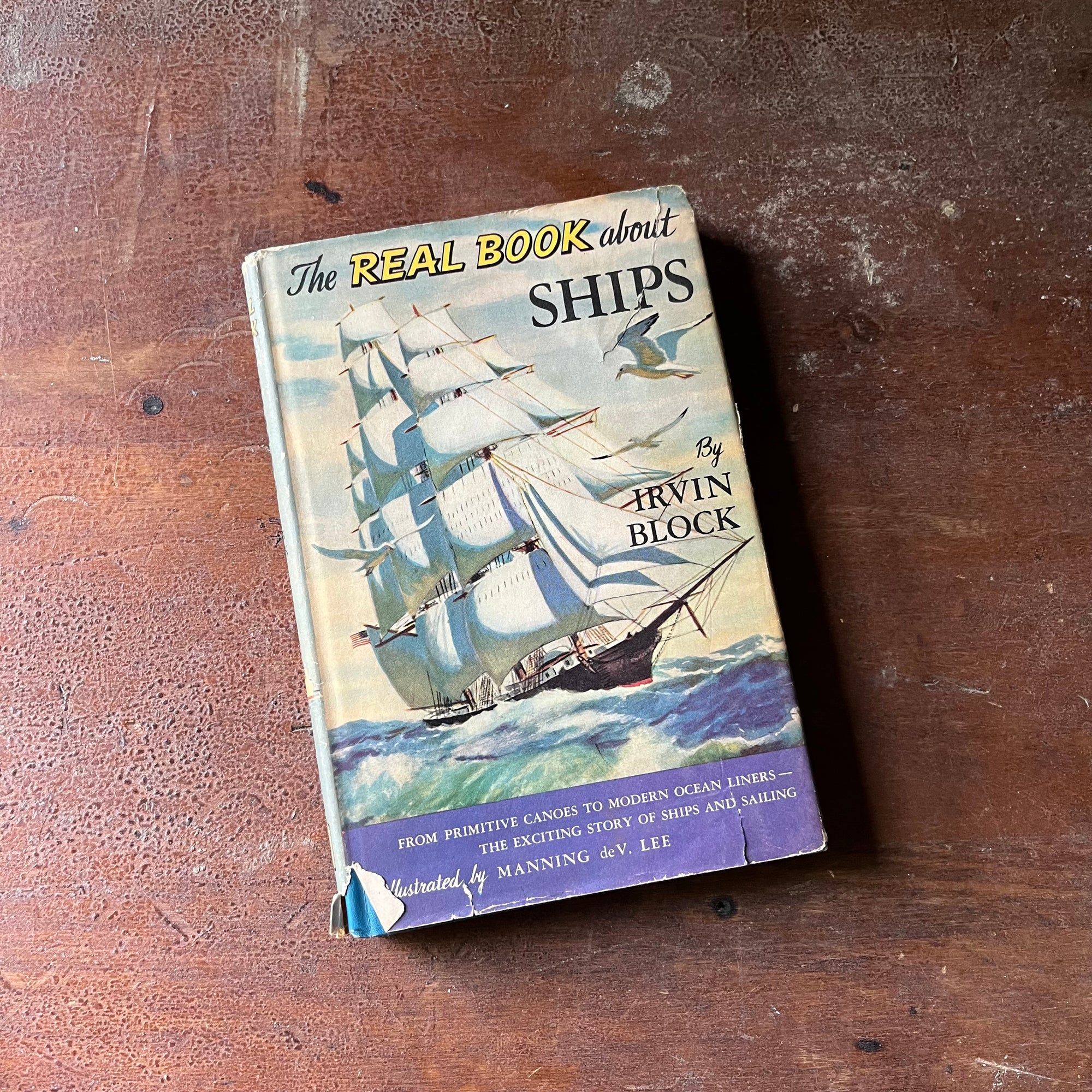 vintage children's book, children's history book, vintage chapter book, The Real Book About Series - The Real Book About Ships by Irvin Block with illustrations by Manning de V. Lee - view of the dust jacket's front cover with an illustration of an old sailing ship