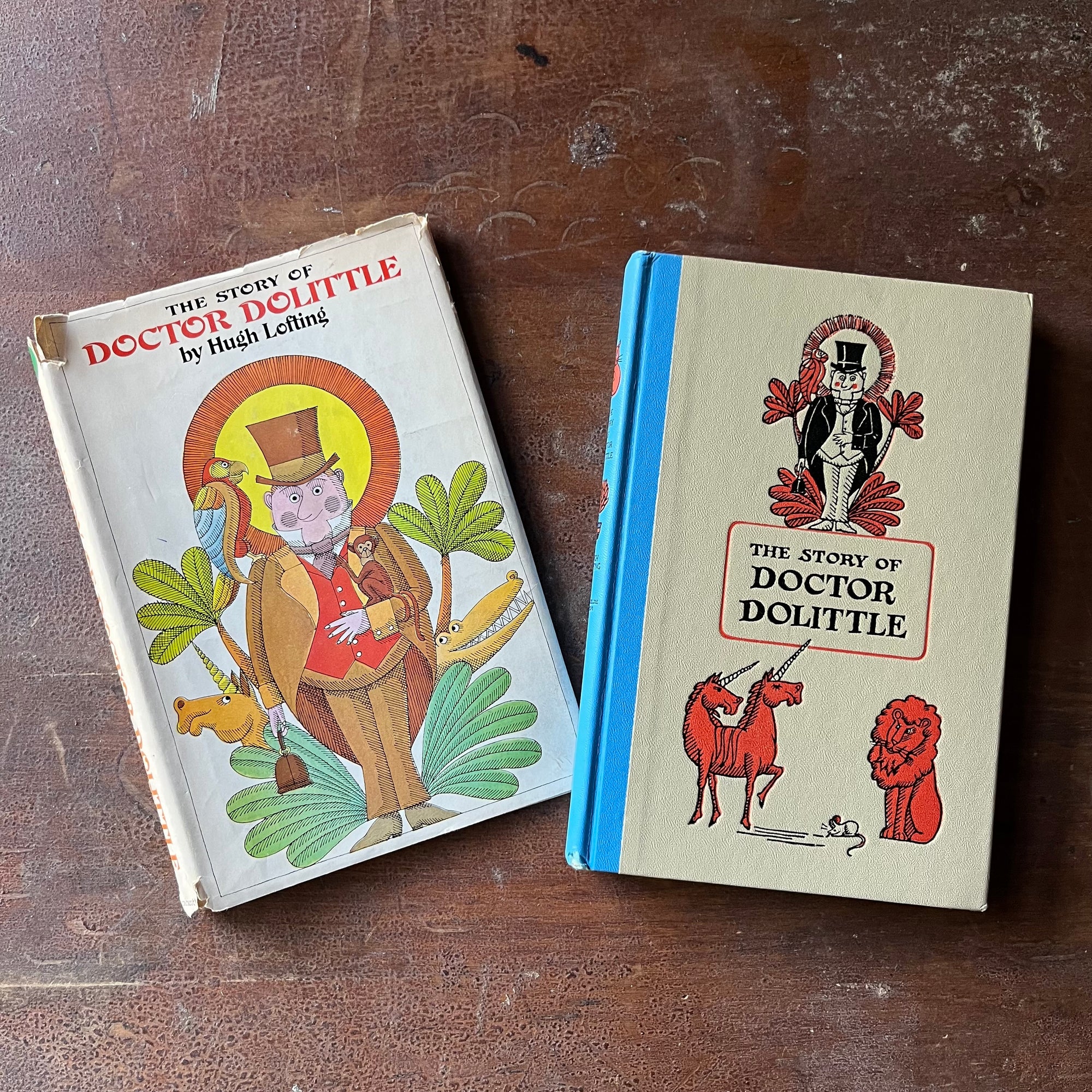 vintage children's chapter book, Junior Deluxe Editions Book - The Story of Doctor Dolittle written by Hugh Lofting with illustrations by Murray Tinkelman - view of the embossed front cover with Doctor Dolittle, a double headed unicorn & a lion on the cover