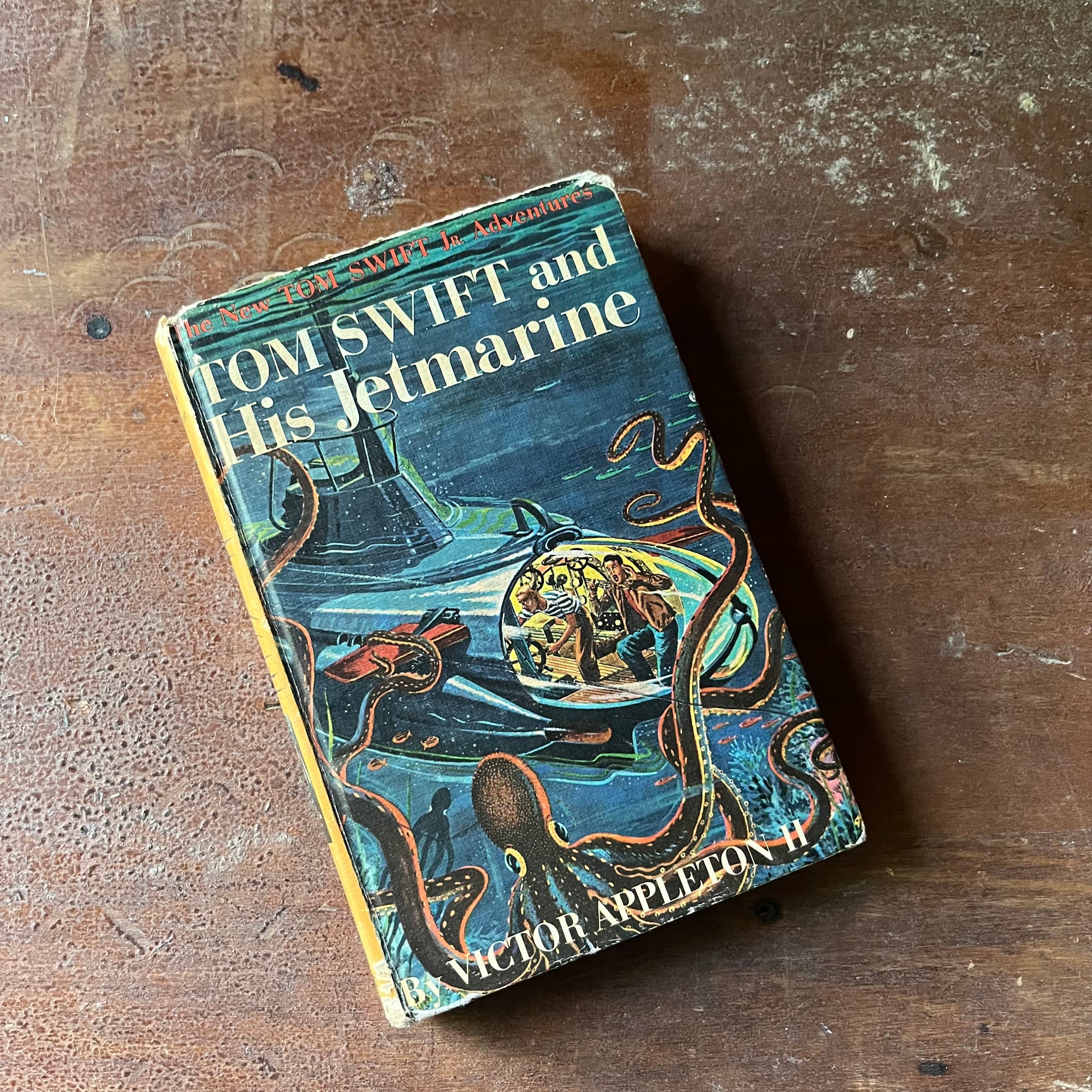 vintage children's chapter book, vintage children's adventure book, The New Tom Swift Jr. Adventure Book - Tom Swift and His Jetmarine written by Victor Appleton II with illustrations by Graham Kaye - view of the front cover