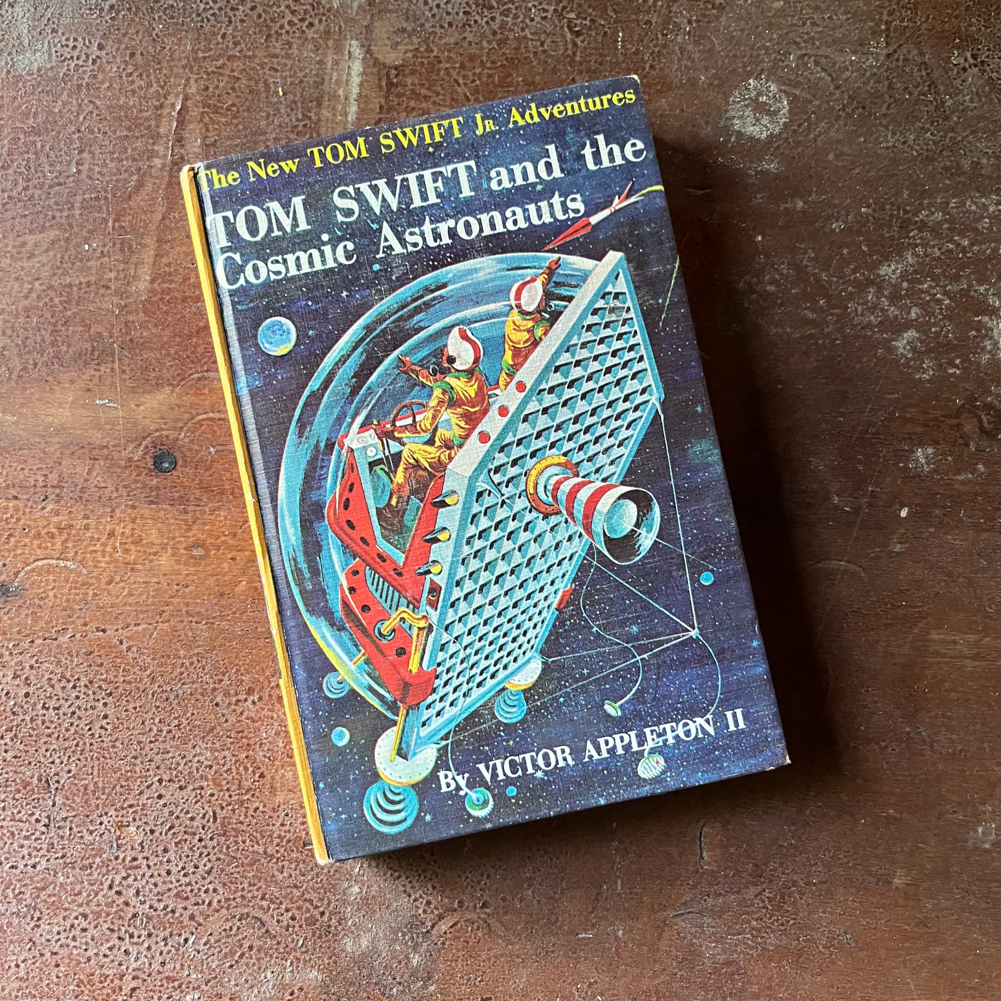 vintage children's chapter book, vintage boy's adventure story, homeschool library, The New Tom Swift Jr. Adventures Book #16 - Tom Swift and the Cosmic Astronauts written by Victor Appleton II with Illustrations by Graham Kaye - view of the front cover