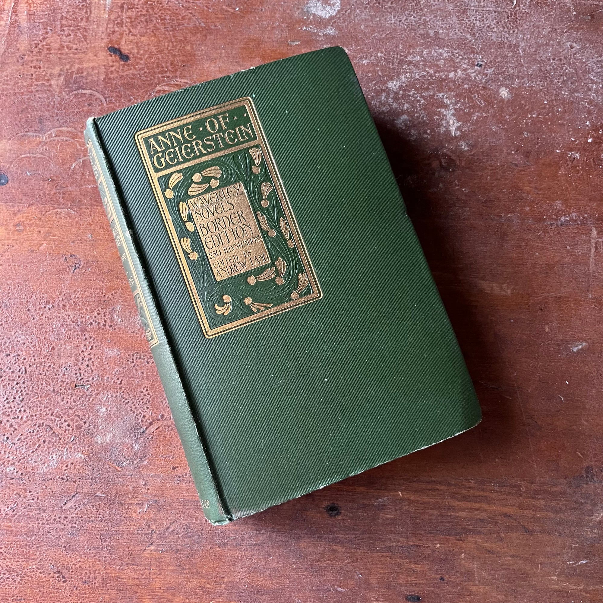 antique book, classic literature - Waverly Novels Border Edition:  Anne of Geierstein written by Sir Walter Scott, Bart. published in 1899-edited by Andrew Lang - view of the embossed front cover in green & gold colors