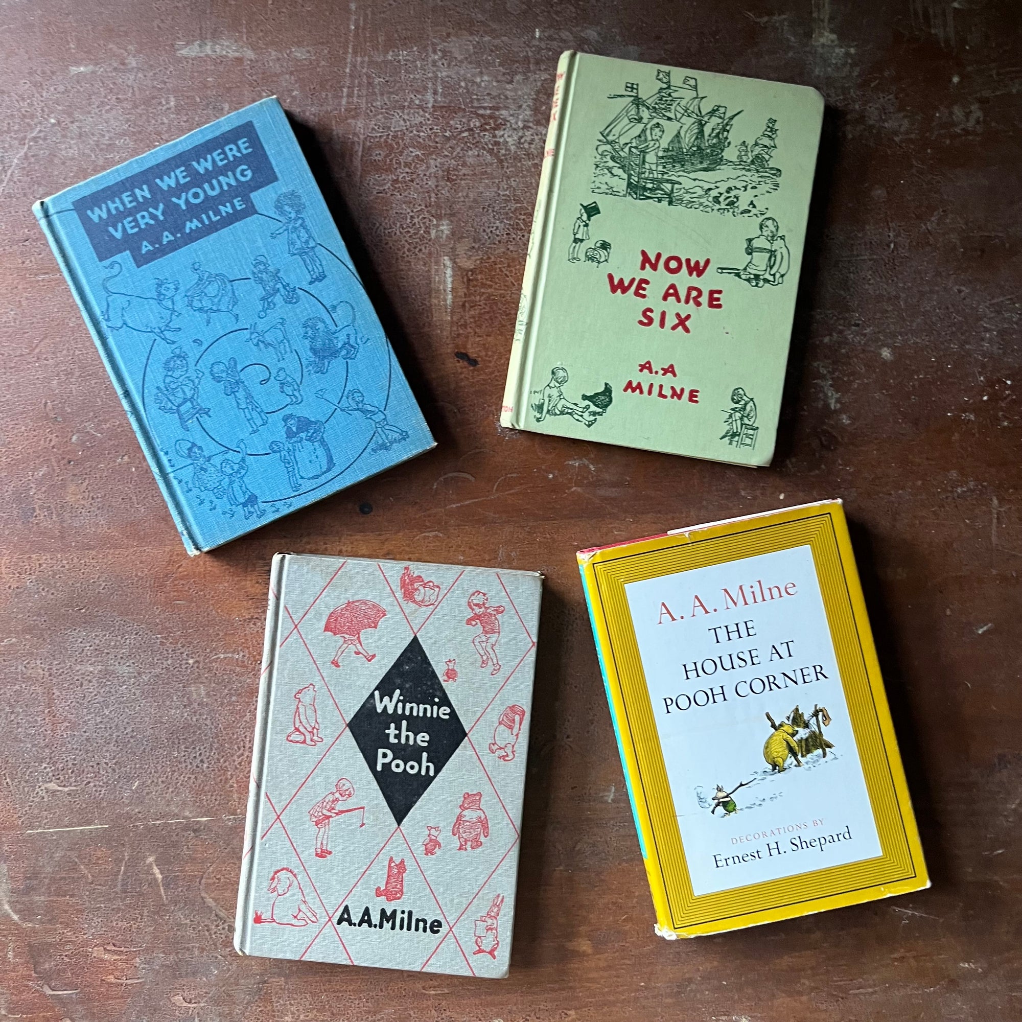 vintage children's storybooks, Winnie the Pooh, The House at Pooh Corner, When We Were Very Young & Now We are Six - Winnie the Pooh Four Book Set written by A. A. Milne with illustrations by Earnest H. Shepard - view of the front covers with a dust jacket on The House at Pooh Corner