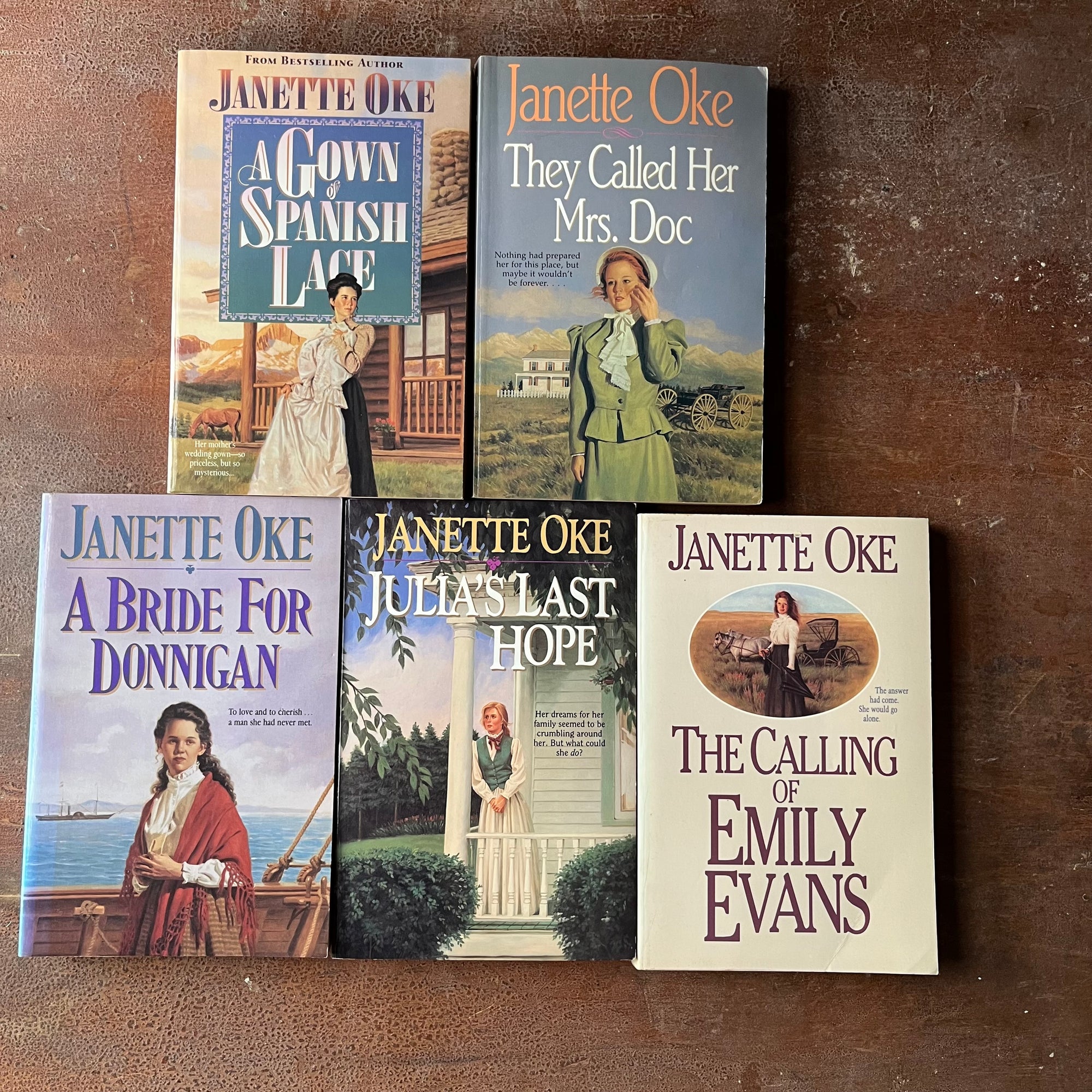 Log Cabin Vintage - Christian fiction, Christian Book Series, Christian Authors, Christian Young Adult Books, Janette Oke - A Five Book Set by Janette Oke:  A Gown of Spanish Lace, They Called Her Mrs. Doc, A Bride for Donnigan, Julia's Last Hope, and The Calling of Emily Evans - view of the front covers