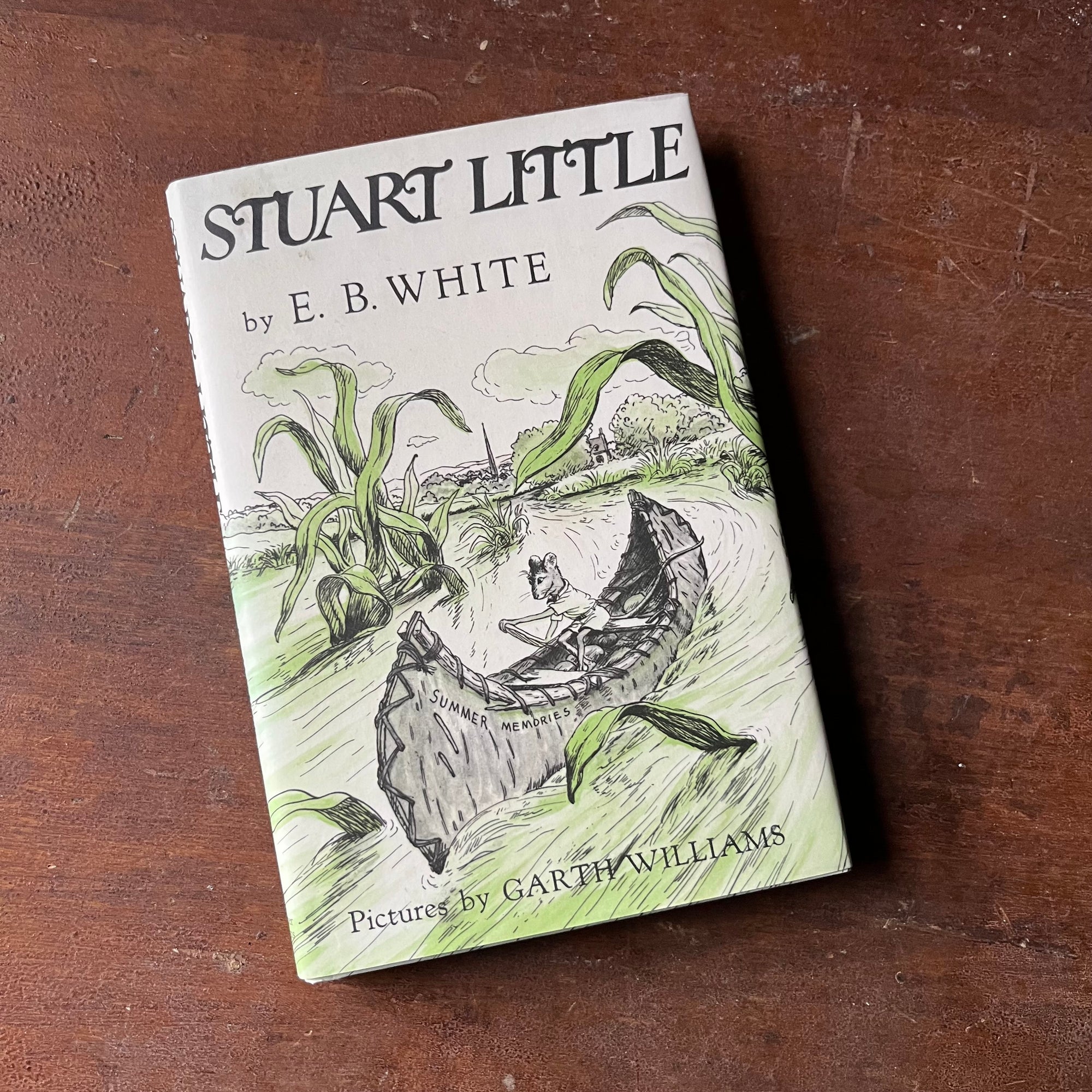 Log Cabin Vintage – vintage children’s book, children’s book, chapter book - Stuart Little written by E. B. White with illustrations by Garth Williams - view of the dust jacket's front cover with Stuart Little in a canoe