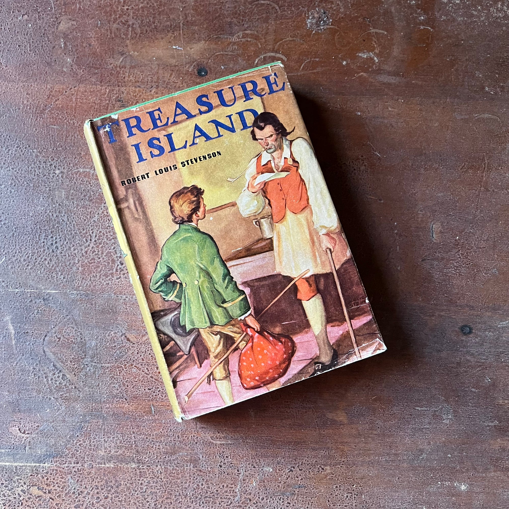 Treasure Island by Robert Louis Stevenson - a Grosset & Dunlap Edition - view of the dust jacket's front cover