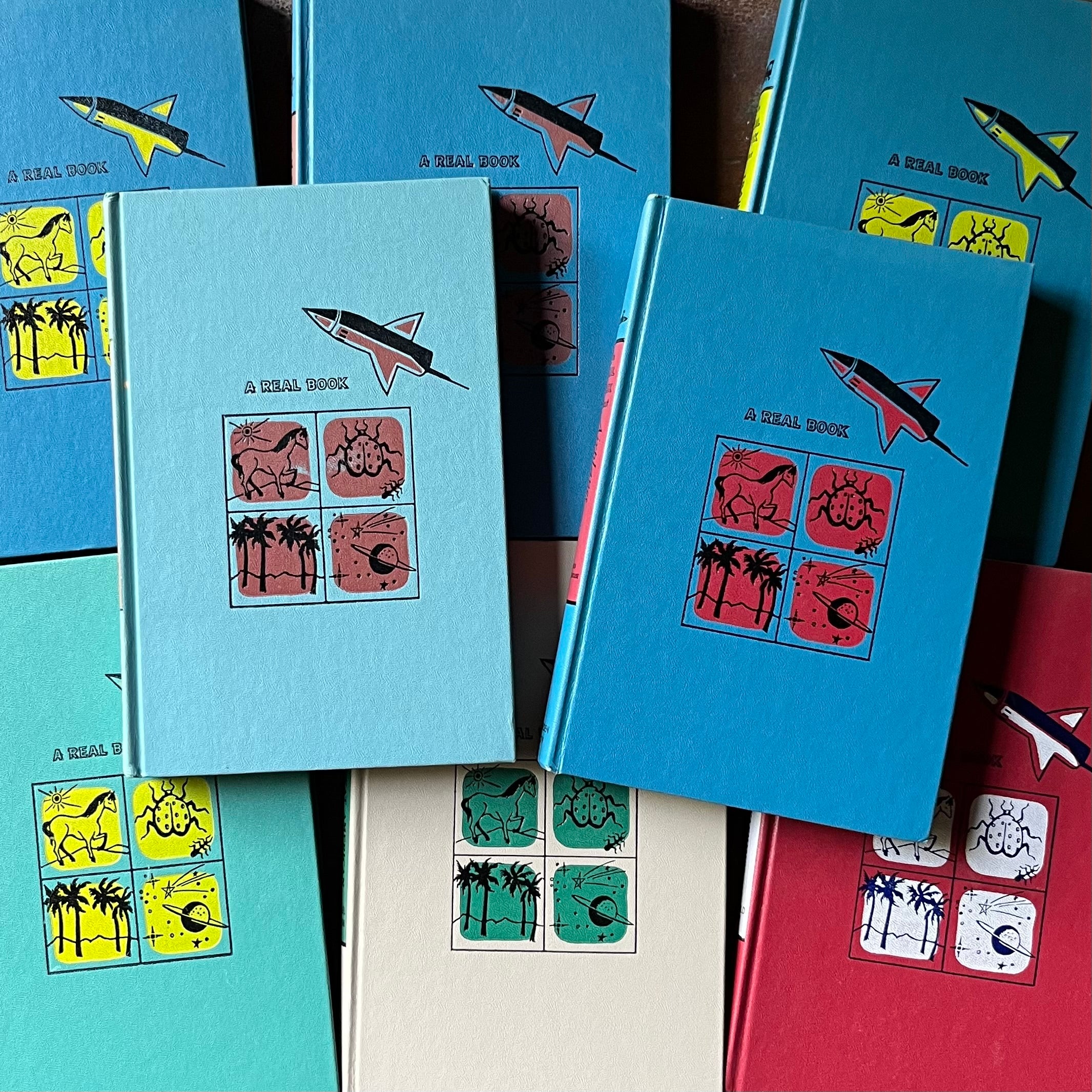 a collage of the Real Book About Series book covers