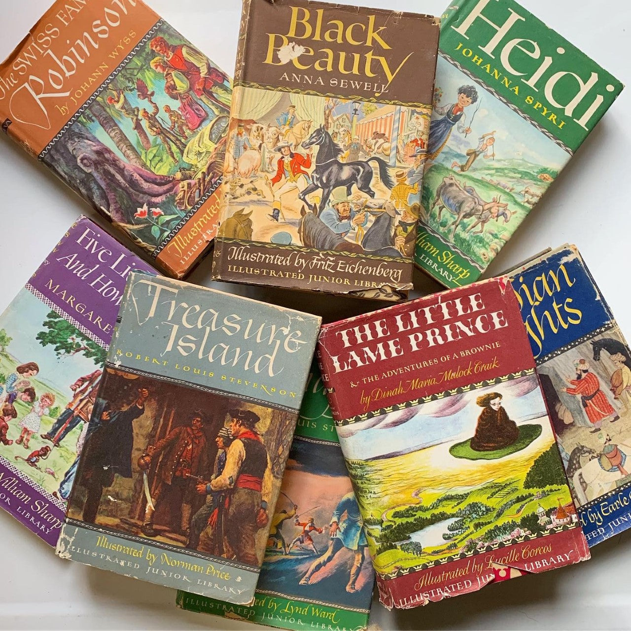 a collage of Illustrated Junior Library Books with dust jackets