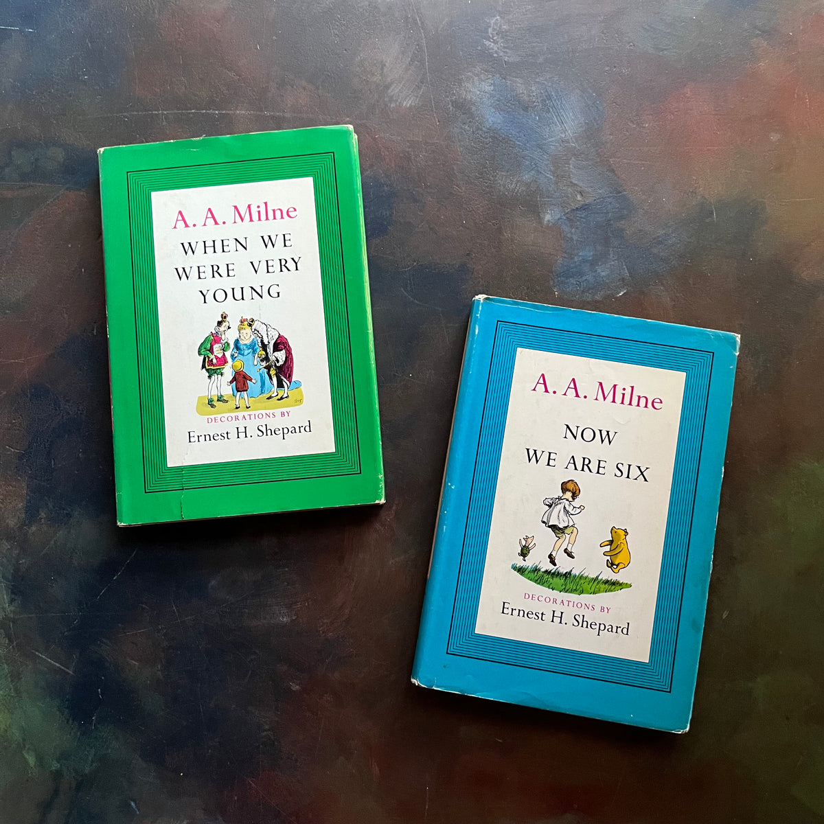A. A. Milne-When We Were Very Young-Now We Are Six-Illustrations by E. H. Shepard-vintage children's short stories-children's poetry-view of the dust jacket's front covers - one with an illustration of Christopher Robin, Winnie the Pooh & Piglet & the Other with The King & Queen