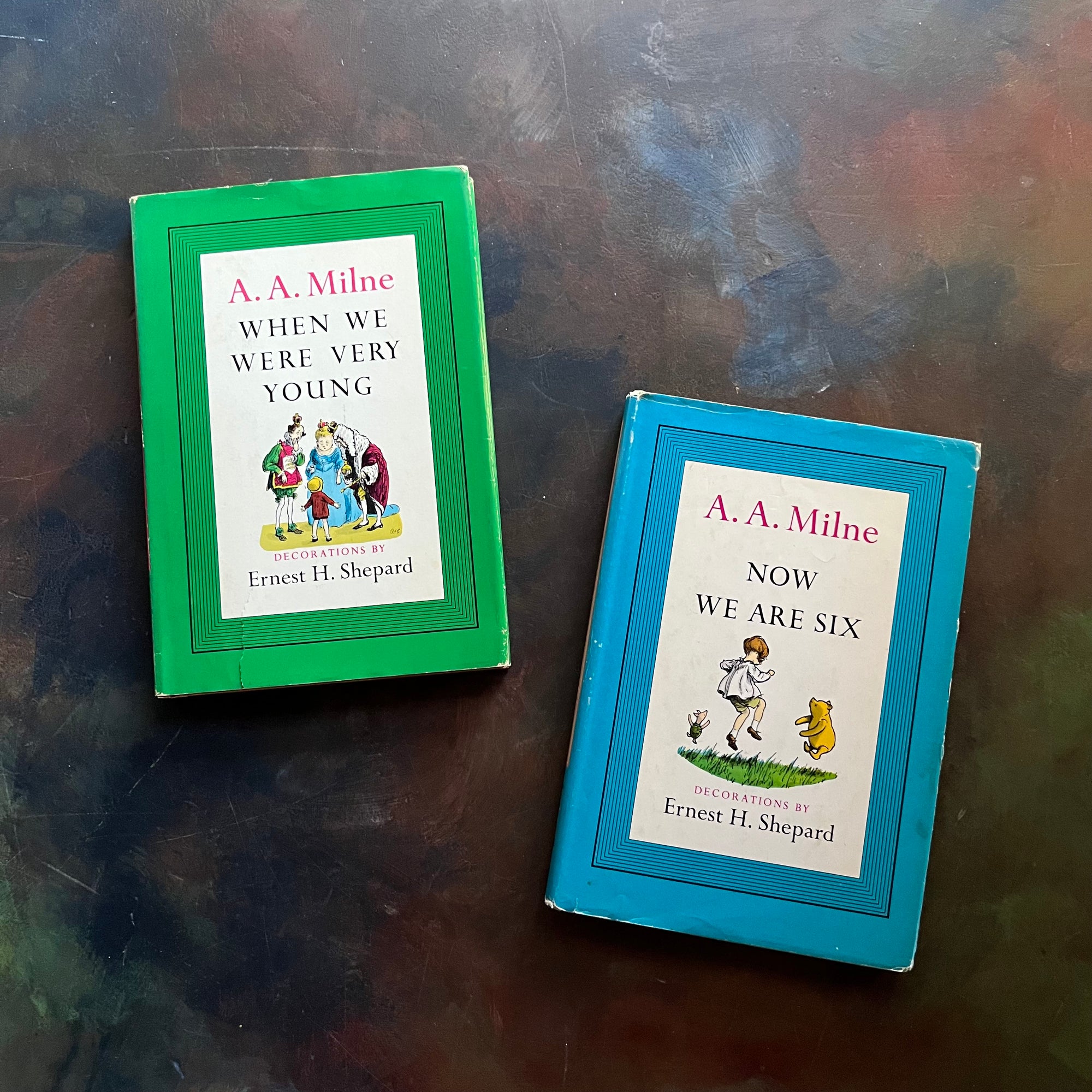 A. A. Milne-When We Were Very Young-Now We Are Six-Illustrations by E. H. Shepard-vintage children's short stories-children's poetry-view of the dust jacket's front covers - one with an illustration of Christopher Robin, Winnie the Pooh & Piglet & the Other with The King & Queen
