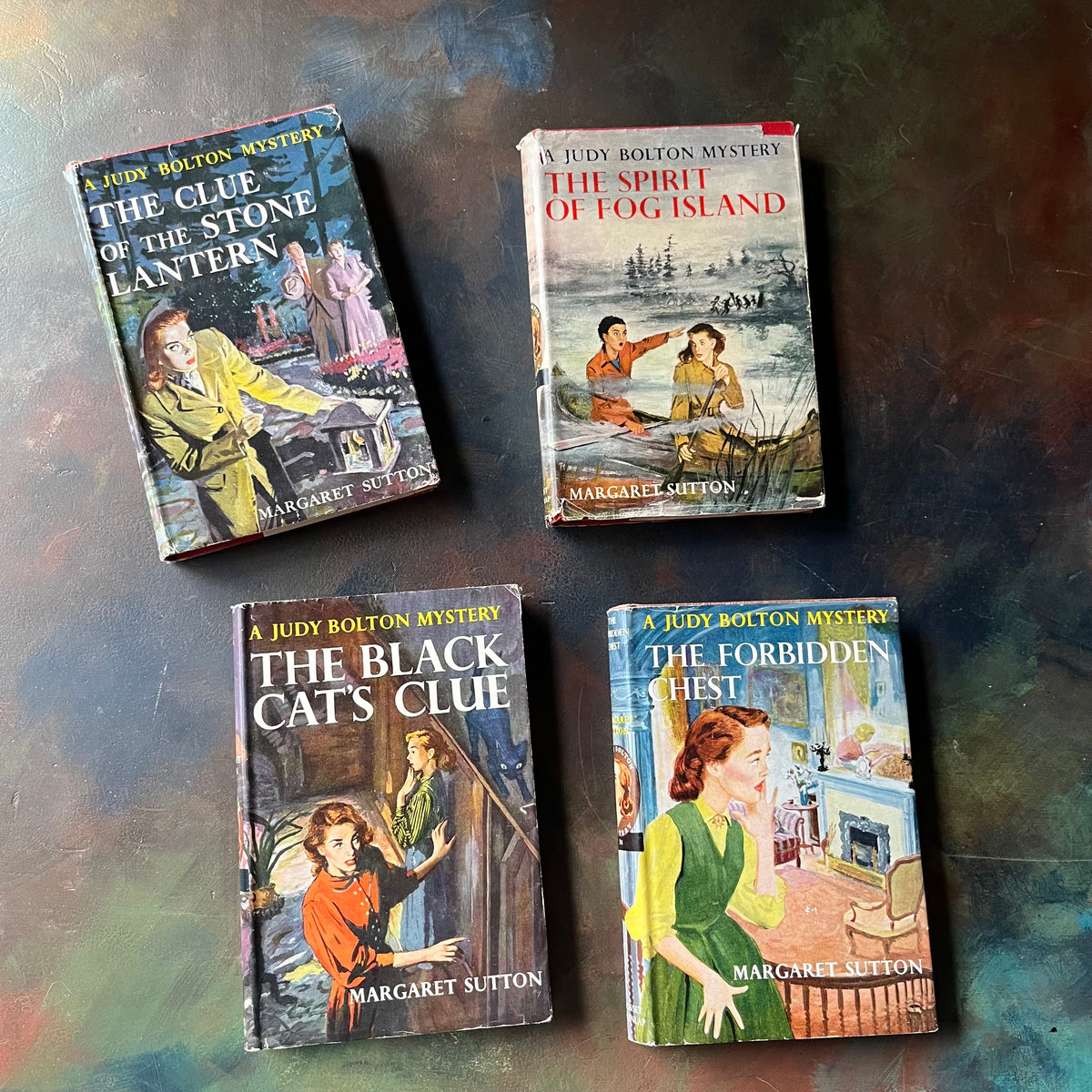 A Judy Bolton Mystery Book Set written by Margaret Sutton with illustrations by Pelangie Doane - Volumes 21 through 24-vintage mystery books for girls-vintage children's mysteries-view of the dust jacket front covers