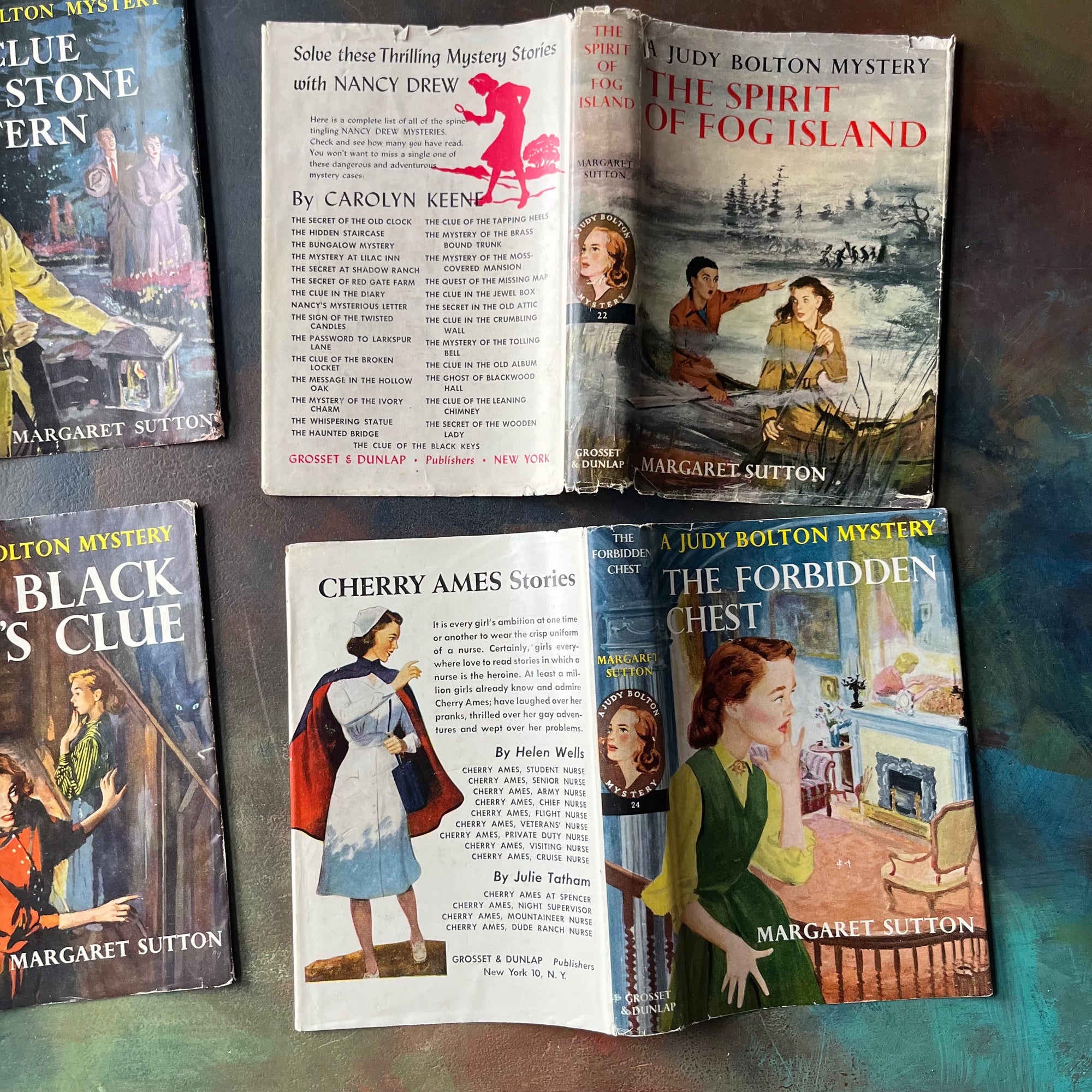 A Judy Bolton Mystery Book Set written by Margaret Sutton with illustrations by Pelangie Doane - Volumes 21 through 24-vintage mystery books for girls-vintage children's mysteries-view of the outside of the dust jackets