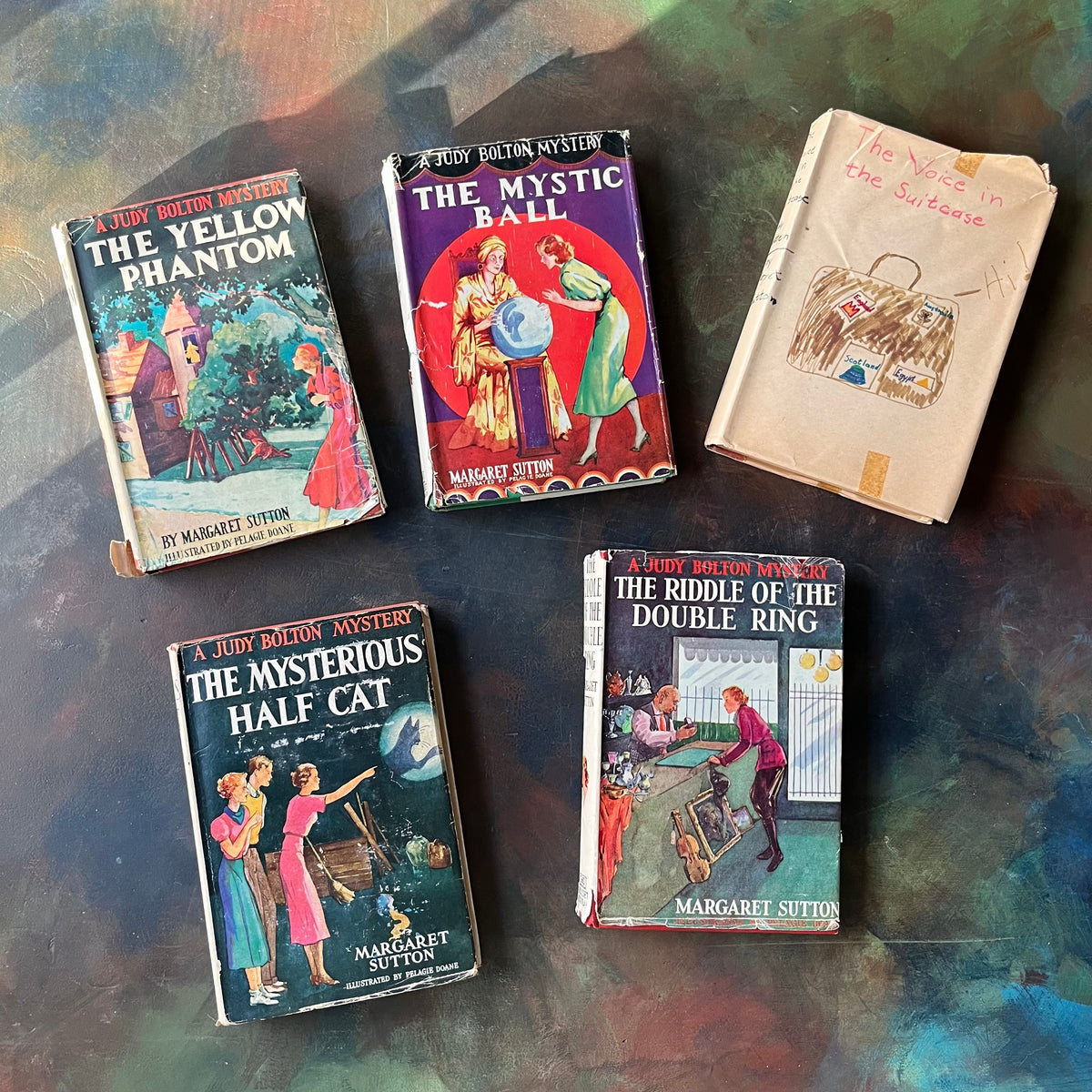 A Judy Bolton Mystery Book Set written by Margaret Sutton with illustrations by Pelagie Doane-Volumes 6 through 10-antique mystery books for girls-children's mystery books-view of the dust jacket covers including a handmade dust jacket