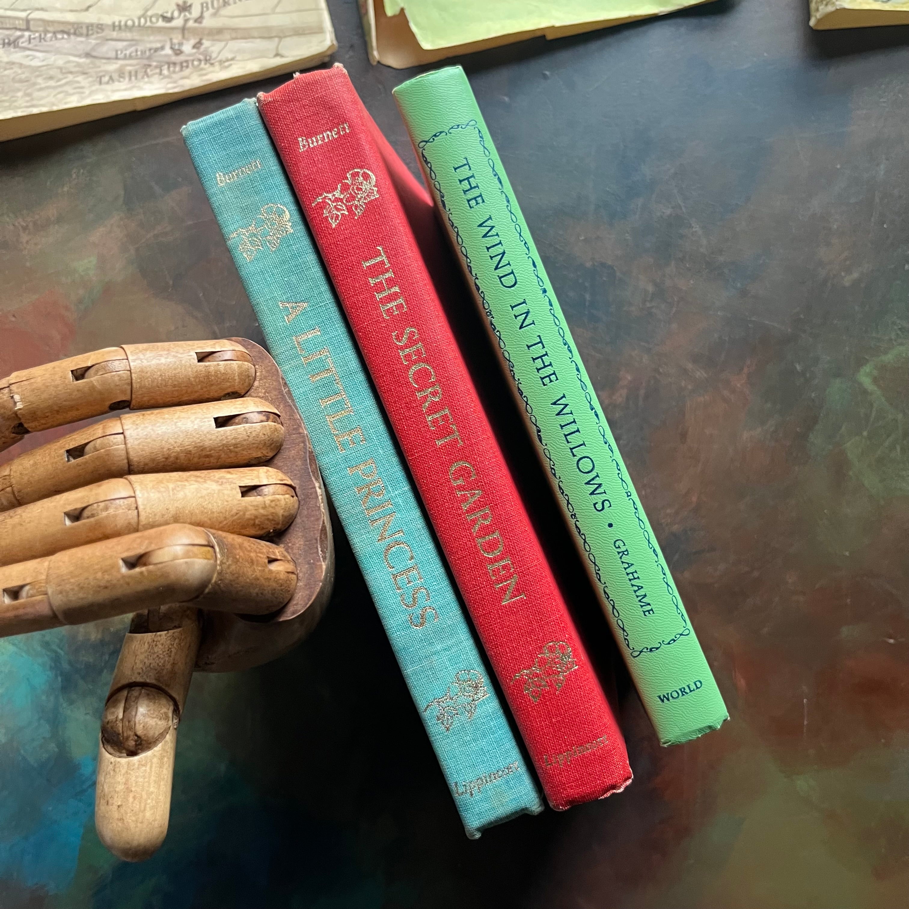 A Little Princess and The Secret Garden written by Frances Hodgson Burnett-A Wind in the Willows written by Kenneth Grahame-illustrated by Tasha Tudor-vintage children's classic books-view of the spines