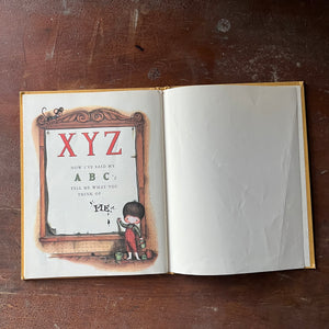 vintage children's picture book - A Mother Goose ABC In a Pumpkin Shell written & illustrated by Joan Walsh Anglund - view of the last page of the book plus a blank page - note the wrinkles on the blank page