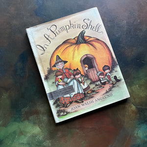 A Mother Goose ABC In a Pumpkin Shell written & illustrated by Joan Walsh Anglund-vintage children's picture book-view of the front cover with Mother Goose sitting outside a pumpkin made into a home surrounded by children