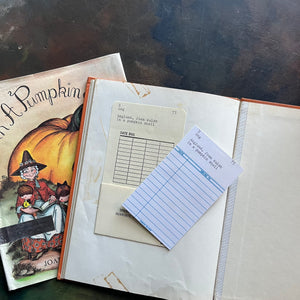 A Mother Goose ABC In a Pumpkin Shell written & illustrated by Joan Walsh Anglund-vintage children's picture book-view of the back, inside cover noting the library pocket and card along with remnants of tape