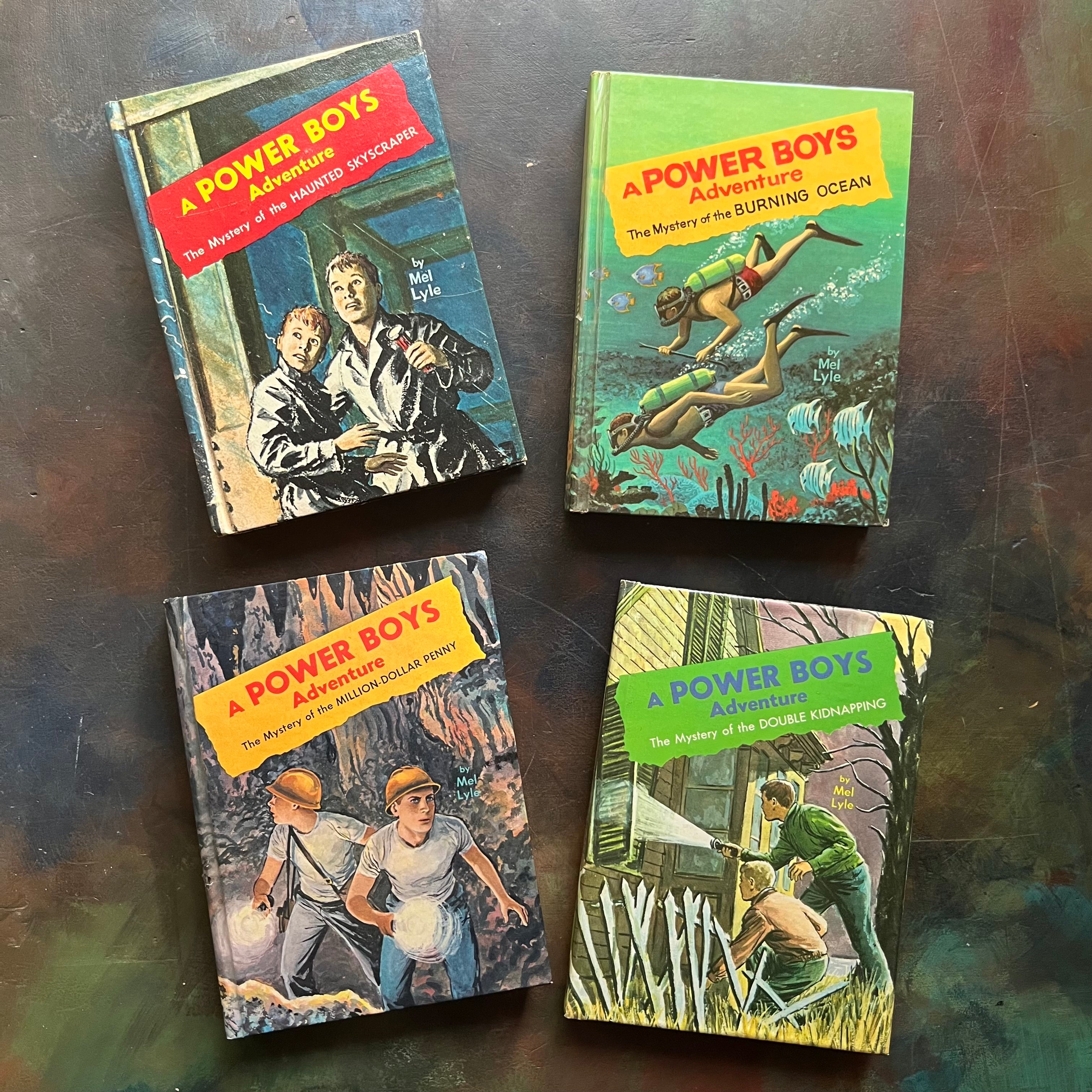 A Power Boys Adventure Book Set-children's mystery books written by Mel Lyle-Whitman Publishing Company chapter books for kids-1960s mystery books for boys-vintage chapter books for kids-view of the front covers with color images depicting scenes from each book
