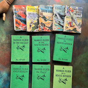 A Set of Six Yankee Flier Books by Al Avery-Air Combat Stories for Boys-antique warplane books-view of the front covers with the dust jacket covers shown above them