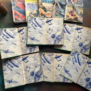 A Set of Six Yankee Flier Books by Al Avery-Air Combat Stories for Boys-antique warplane books-view of the inside covers with blue planes in a dog fight in the air
