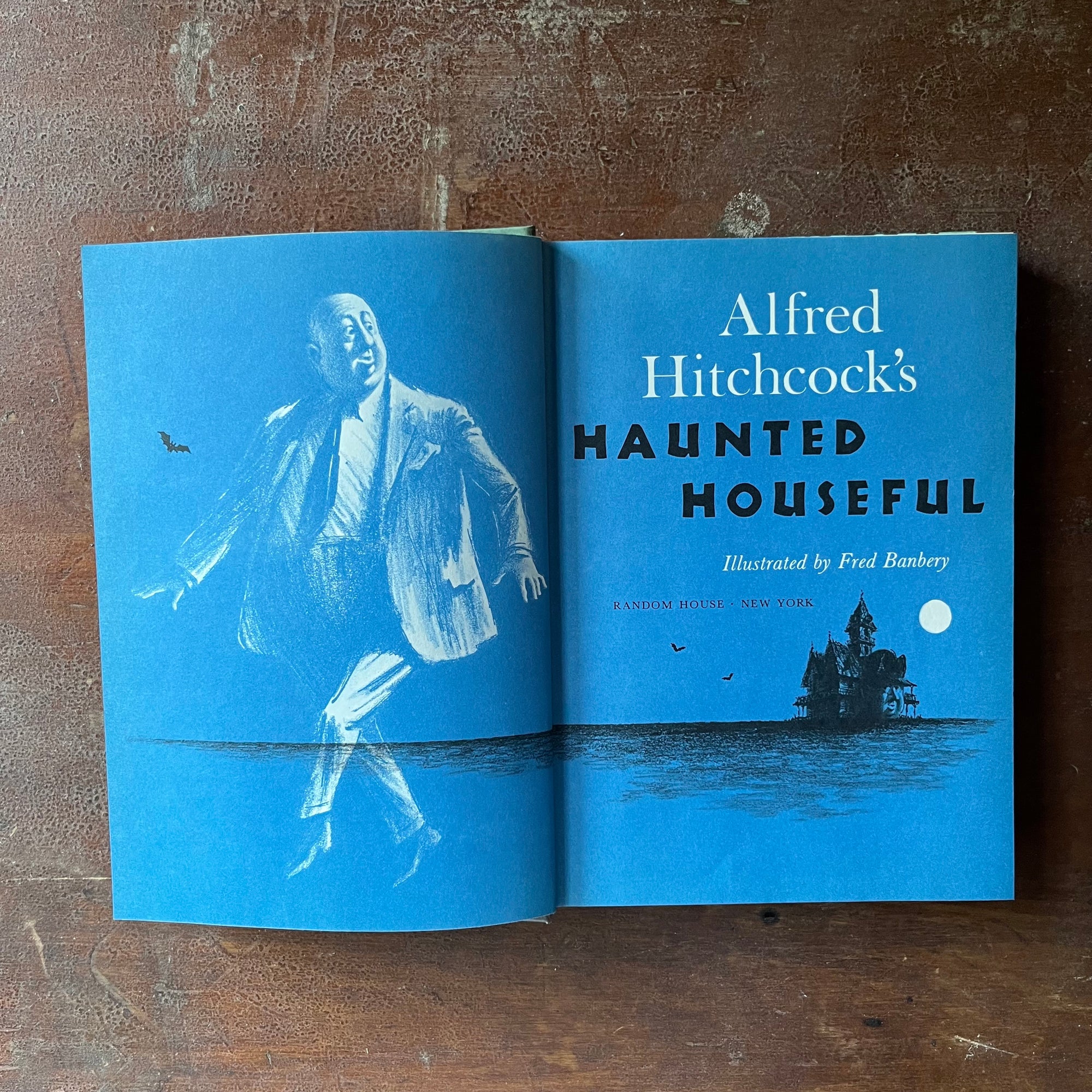 vintage mystery book for children - Alfred Hitchcock's Haunted Houseful written by Alfred Hitchcock with illustrations by Fred Banbery - view of the title page with Alfred Hitchcock in the illustration on the left & the haunted house on the actual title page