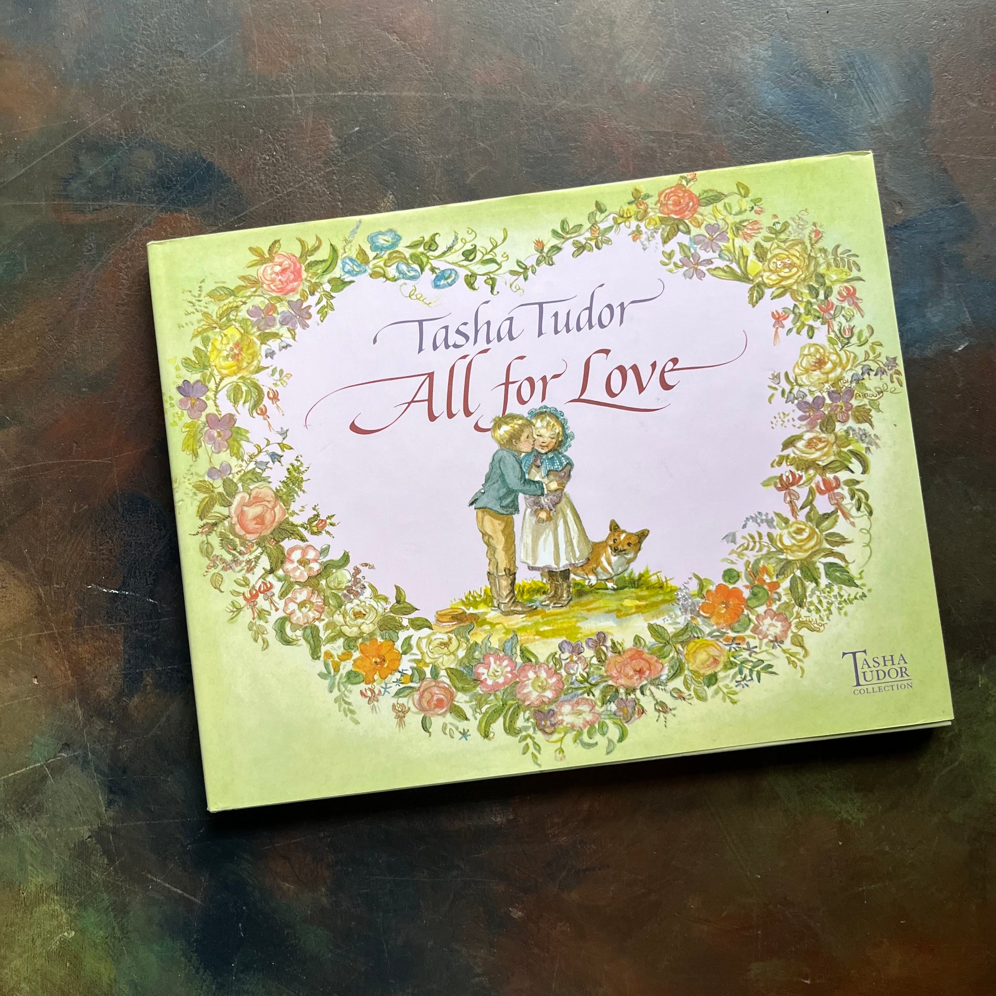 All for Love Selected by Tasha Tudor-Tasha Tudor Collection-vintage poetry for children-vintage short stories-view of the dust jacket's cover with an illustration of a boy kissing a girl on the cheek with a corgi next to them.
