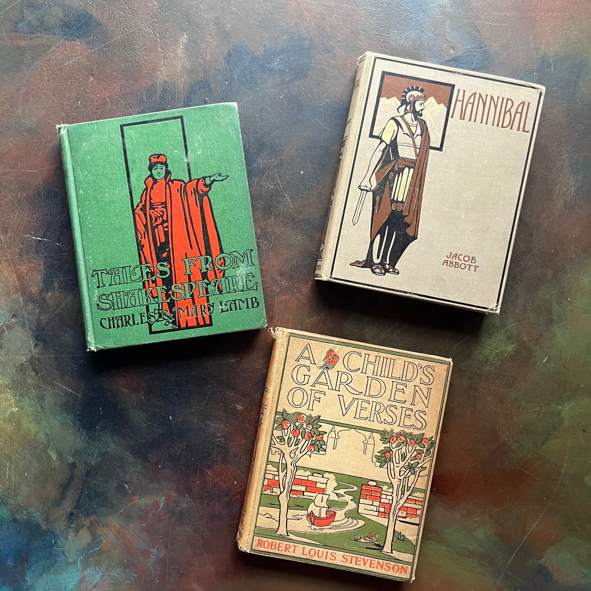 Set of three books from The Altemus' Young People's Library Series: A Child's Garden of Verses, History of Hanibal the Carthaginian, and Tales from Shakespeare-view of their front covers all with an image on each one