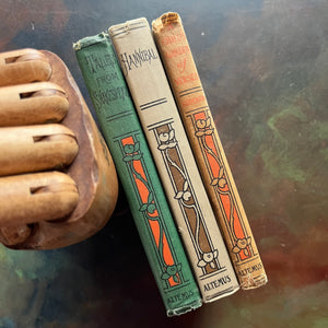 Set of three books from The Altemus' Young People's Library Series: A Child's Garden of Verses, History of Hanibal the Carthaginian, and Tales from Shakespeare - view of the spines with the same design used for this series printed by the Henry Altemus Company.