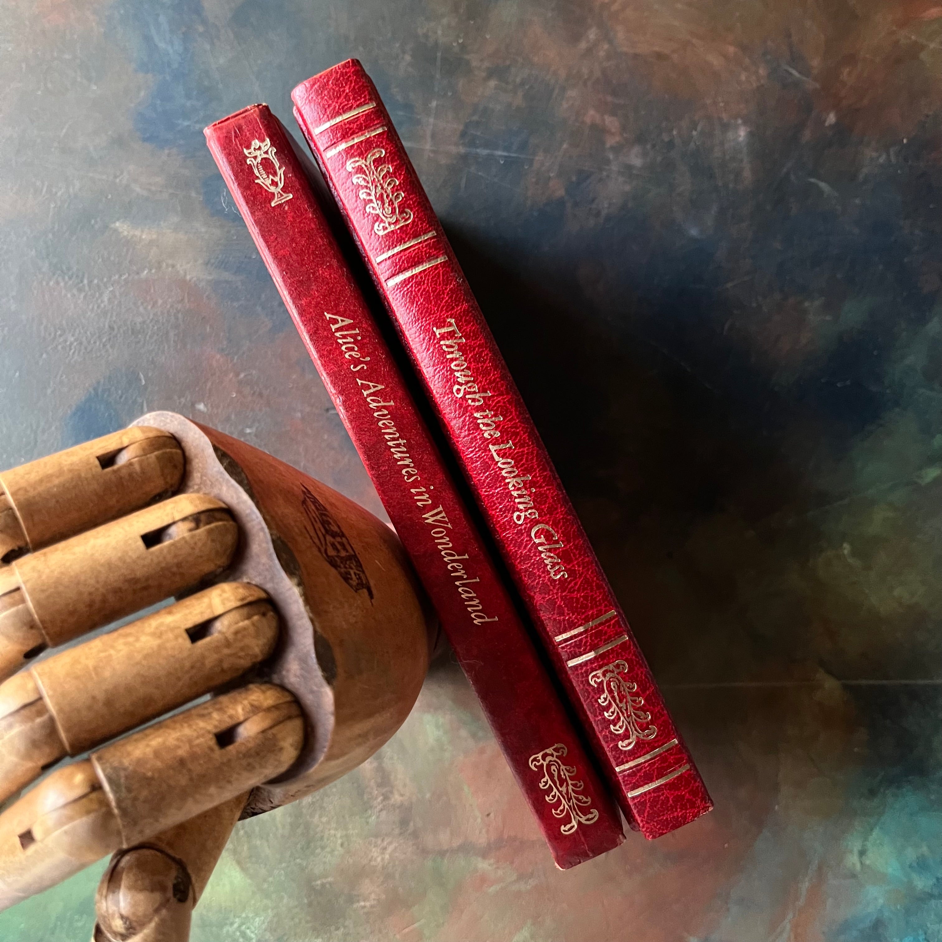 Pair of Avenal Publishers Books-Alice's Adventures in Wonderland-Through the Looking Glass & What Alice Found There-written by Lewis Carroll with illustrations by John Tenniel-vintage children's classic literature-view of the spines