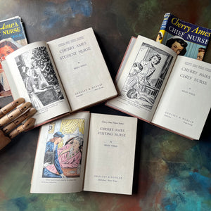 Cherry Ames Book Set-Cherry Ames Student Nurse-Cherry Ames Chief Nurse-Cherry Ames Visiting Nurse-vintage children's mystery books-view of the title pages with frontispieces - note someone colored in the frontispiece in one edition