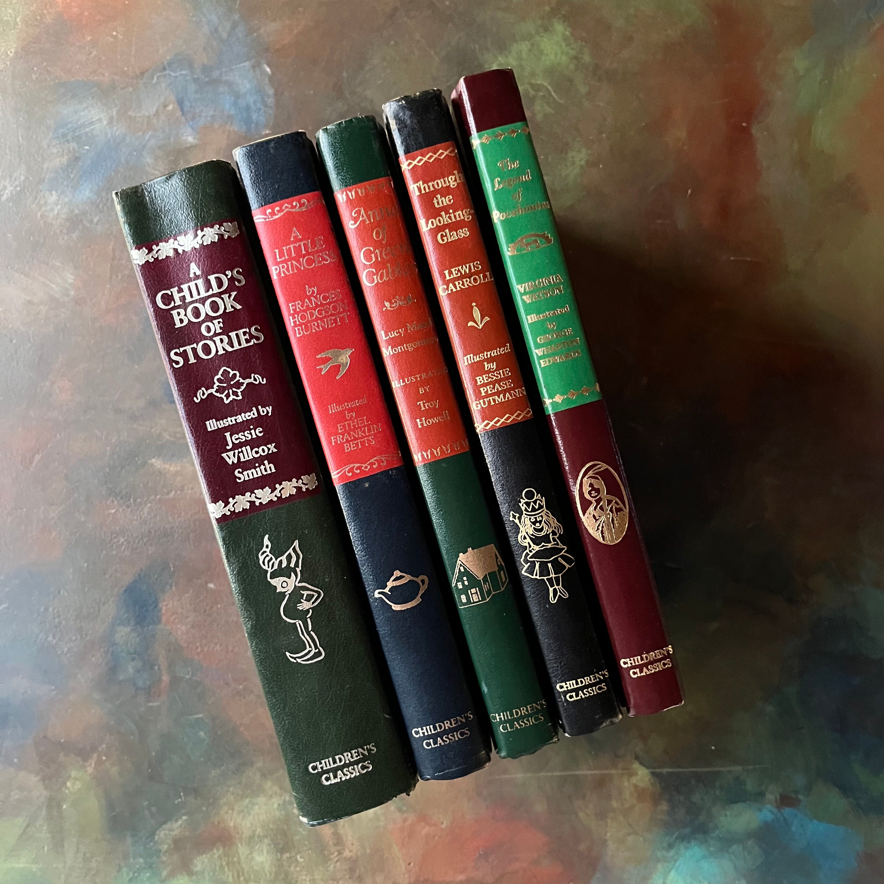 1980's The Children's Classics Editions Book Set of Five Books-The Little Princess-Through the Looking Glass and What Alice Saw There-The Legend of Pocahontas-Anne of Green Gables-The Child's Book of Stories-vintage children's classics-view of the spines