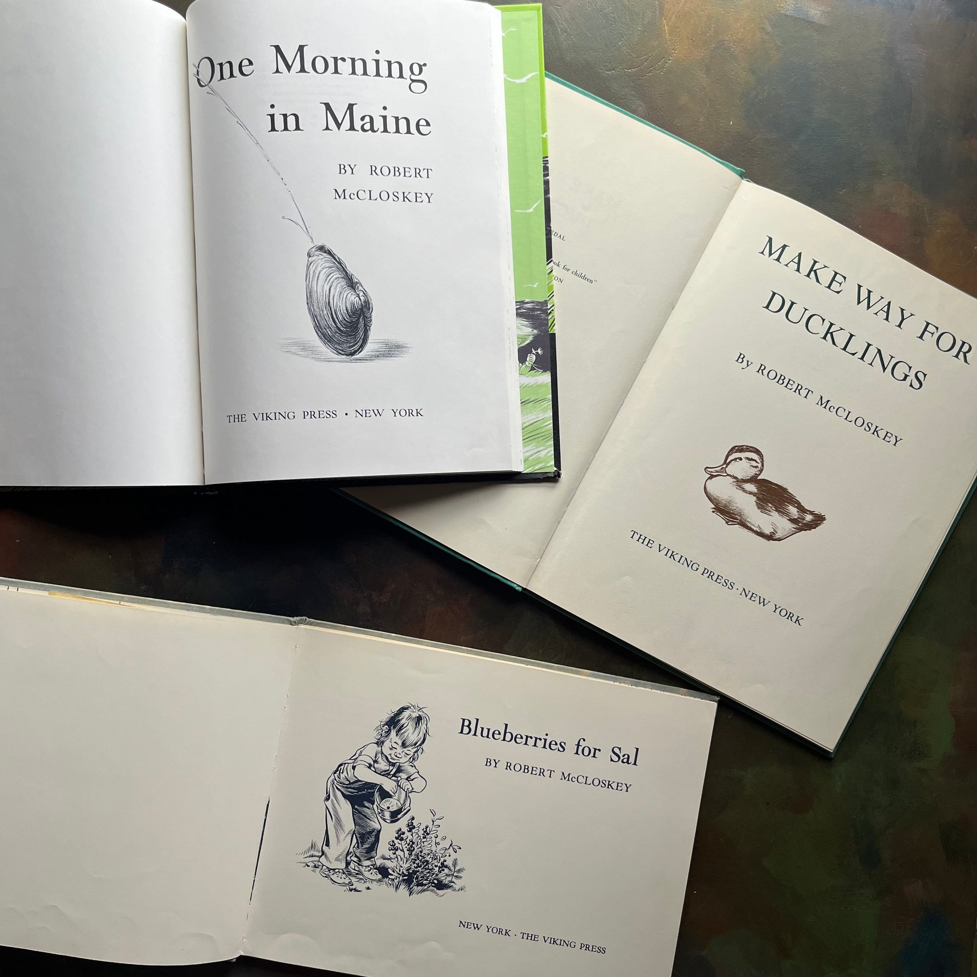 Set of Three iconic children's picture books-One Morning in Maine, Blueberries for Sal, and Make Way for Ducklings-award-winning children's picture book classics written and illustrated by Robert McCloskey-Caldecott Award Winning Books- view of the title pages