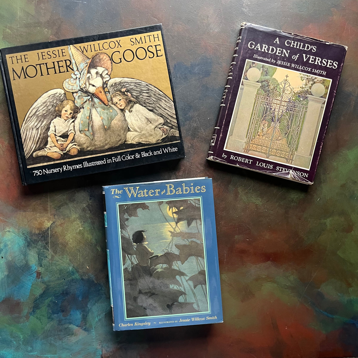 Classic children's Literature illustrated by Jessie Wilcox Smith-The Jessie Wilcox Smith Mother Goose-The Water Babies by Charles Kingsley-A Child's Garden of Verses by Robert Louis Stevenson-view of the front covers with dust jackets