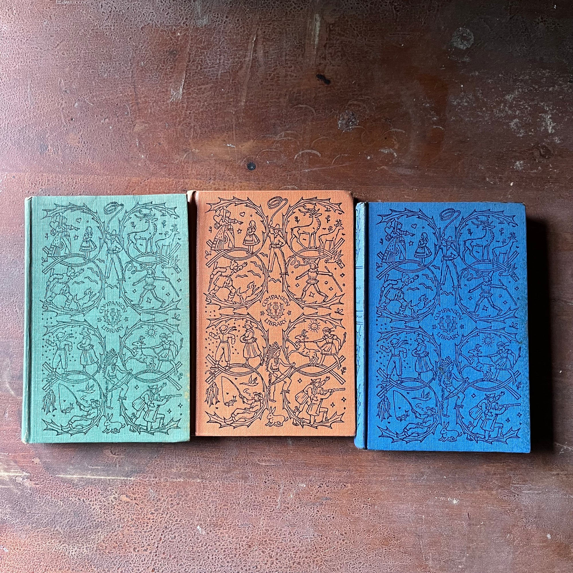 vintage collectible books, vintage children's chapter books - Companion Library Book Set-Alice in Wonderland, Bambi & The Adventures of Tom Sawyer - view of the embossed front covers with the signature illustration for this series
